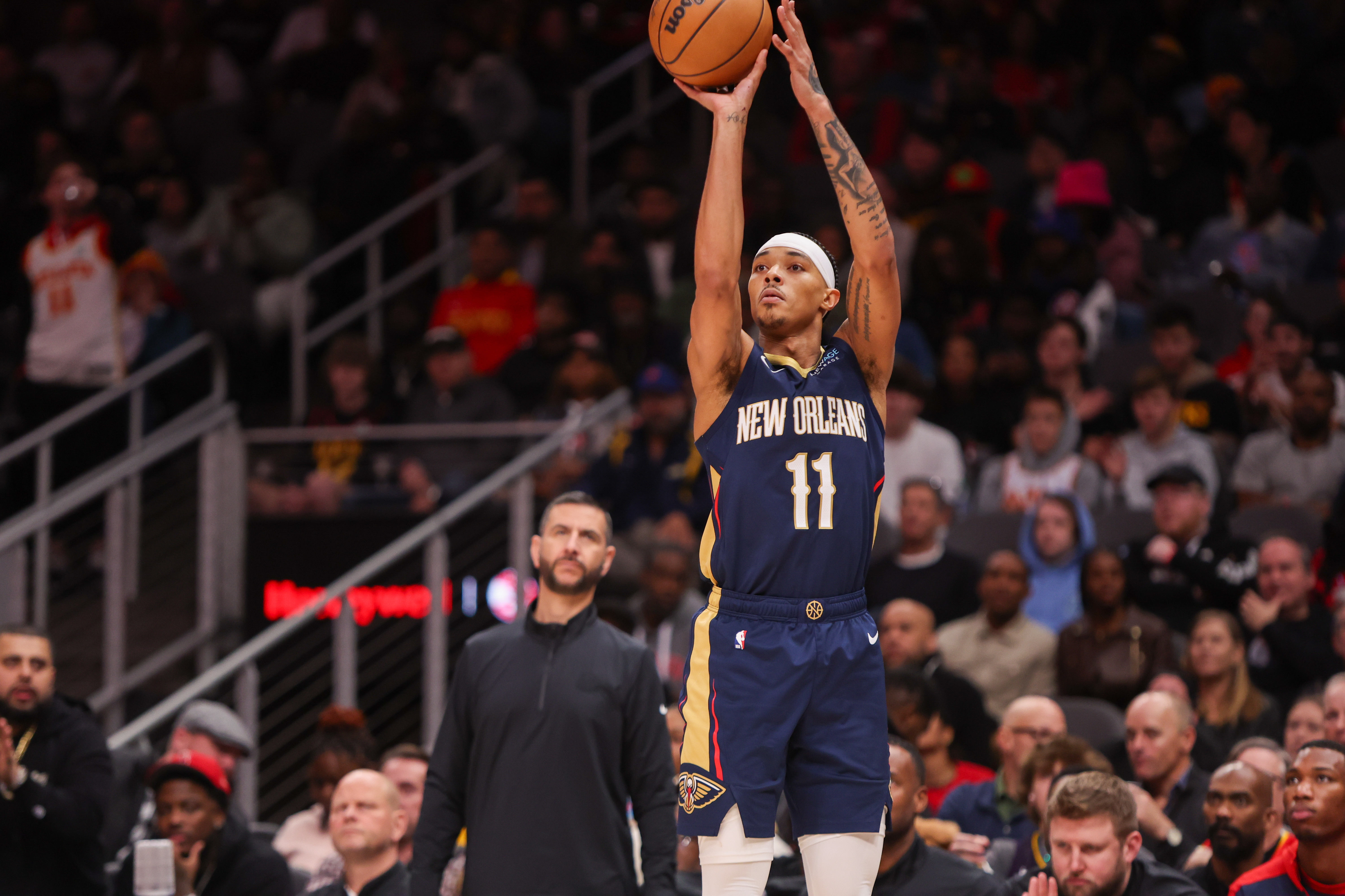 Dec 2, 2024; Atlanta, Georgia, USA; New Orleans Pelicans guard Brandon Boston Jr. (11) shoots against the Atlanta Hawks in the third quarter at State Farm Arena. Mandatory Credit: Brett Davis-Imagn Images  