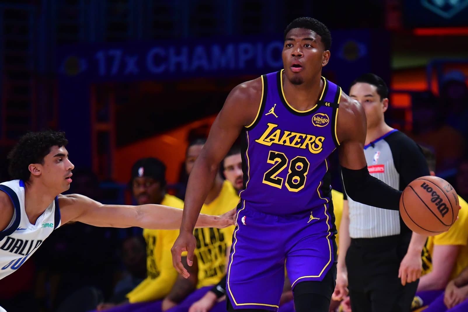 Los Angeles Lakers forward Rui Hachimura (28) dribbles the ball on Dallas Mavericks guard Max Christie (00) during the first quarter at Crypto.com Arena.