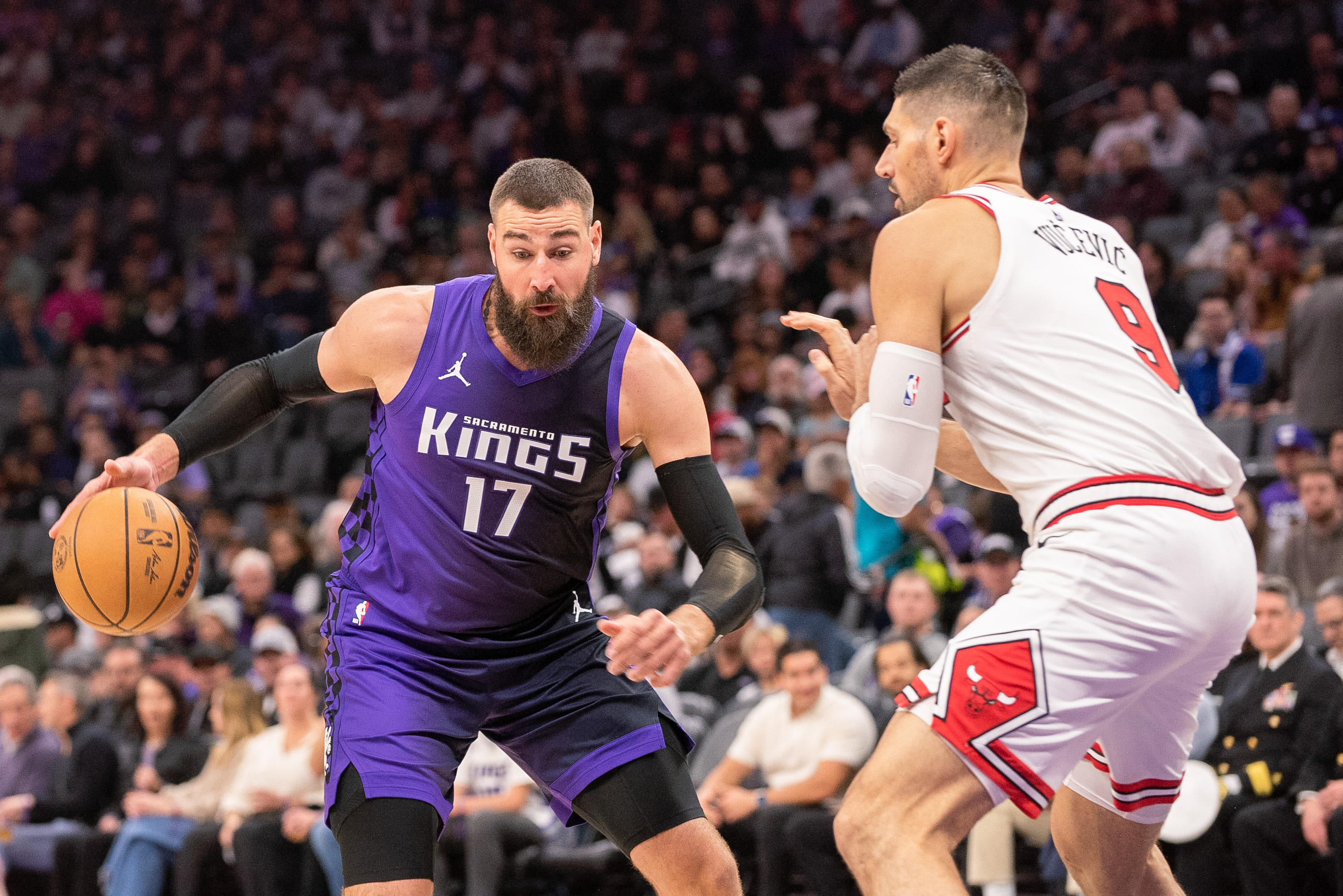 Mar 20, 2025; Sacramento, California, USA; Sacramento Kings center Jonas Valanciunas (17) controls the ball against Chicago Bulls center Nikola Vucevic (9) during the first quarter at Golden 1 Center. Mandatory Credit: Ed Szczepanski-Imagn Images  