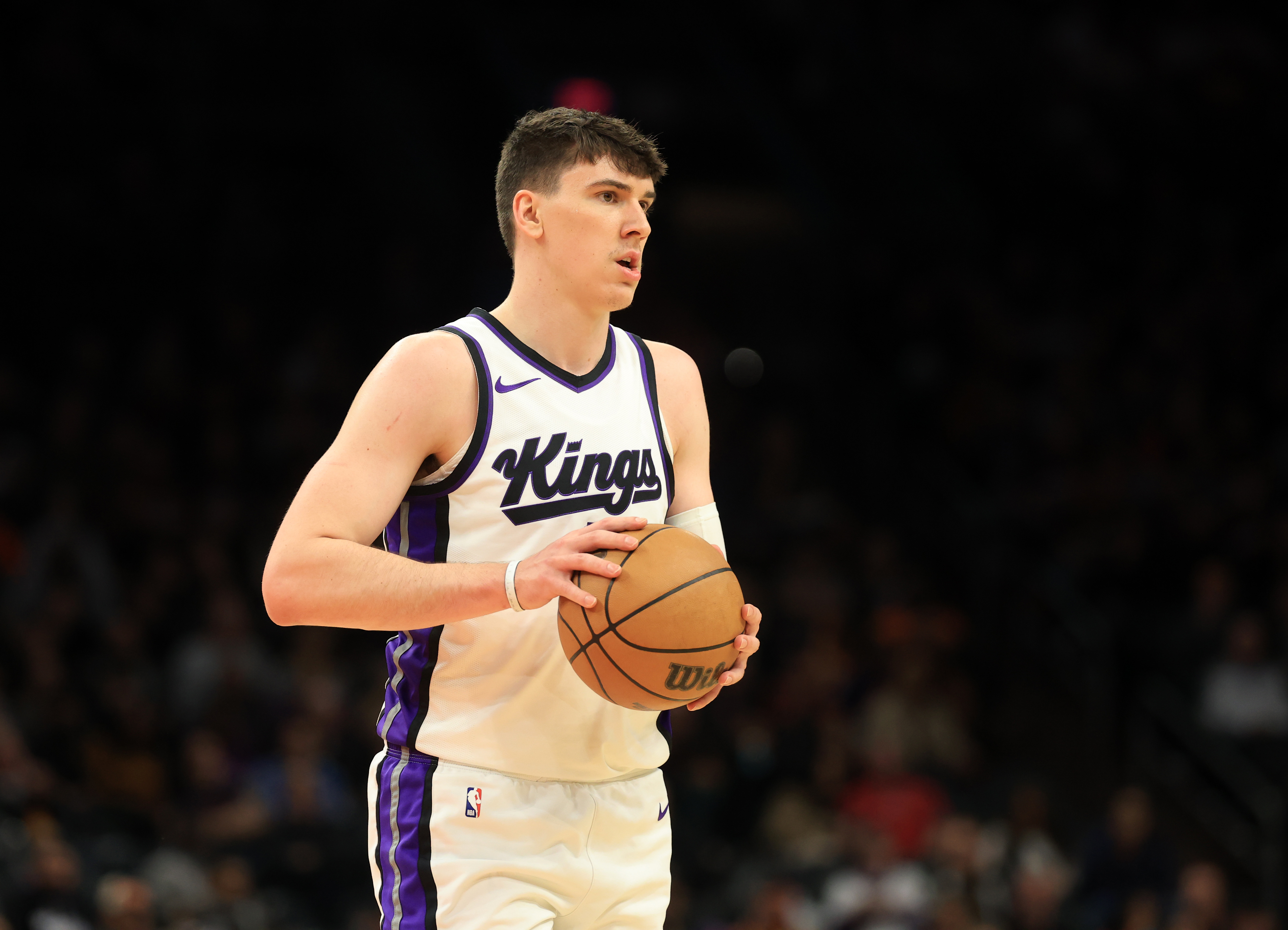 Mar 14, 2025; Phoenix, Arizona, USA; Sacramento Kings forward Jake LaRavia (33) against the Phoenix Suns at Footprint Center. Mandatory Credit: Mark J. Rebilas-Imagn Images  