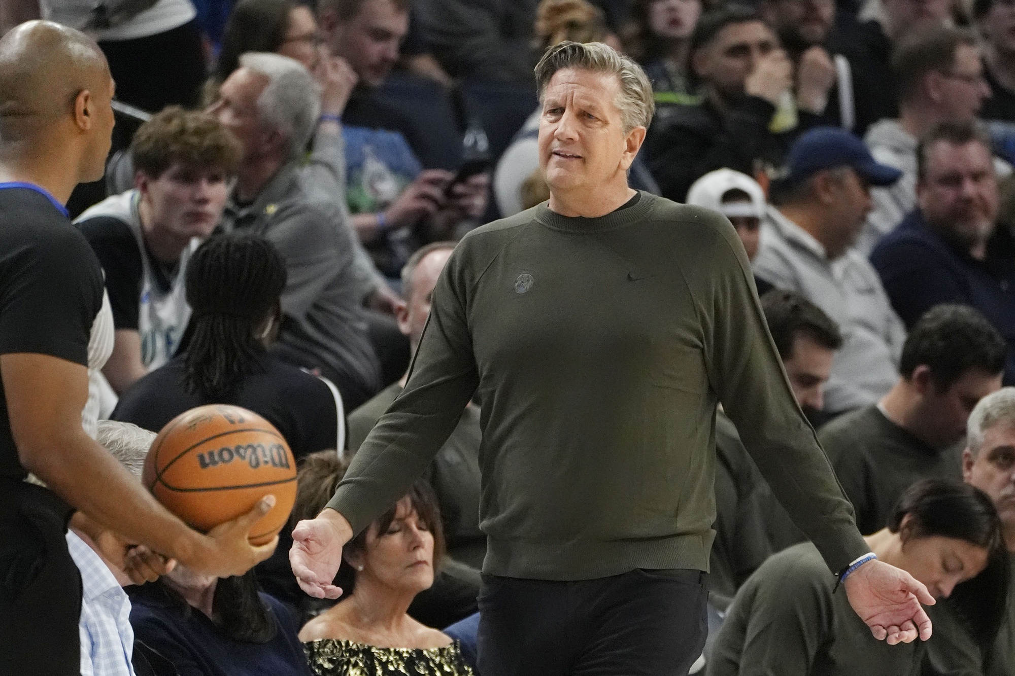 Minnesota Timberwolves head coach Chris Finch questions referee John Butler about a call in the second quarter of the game with the Phoenix Suns at Target Center. Mandatory Credit: Bruce Kluckhohn-Imagn Images