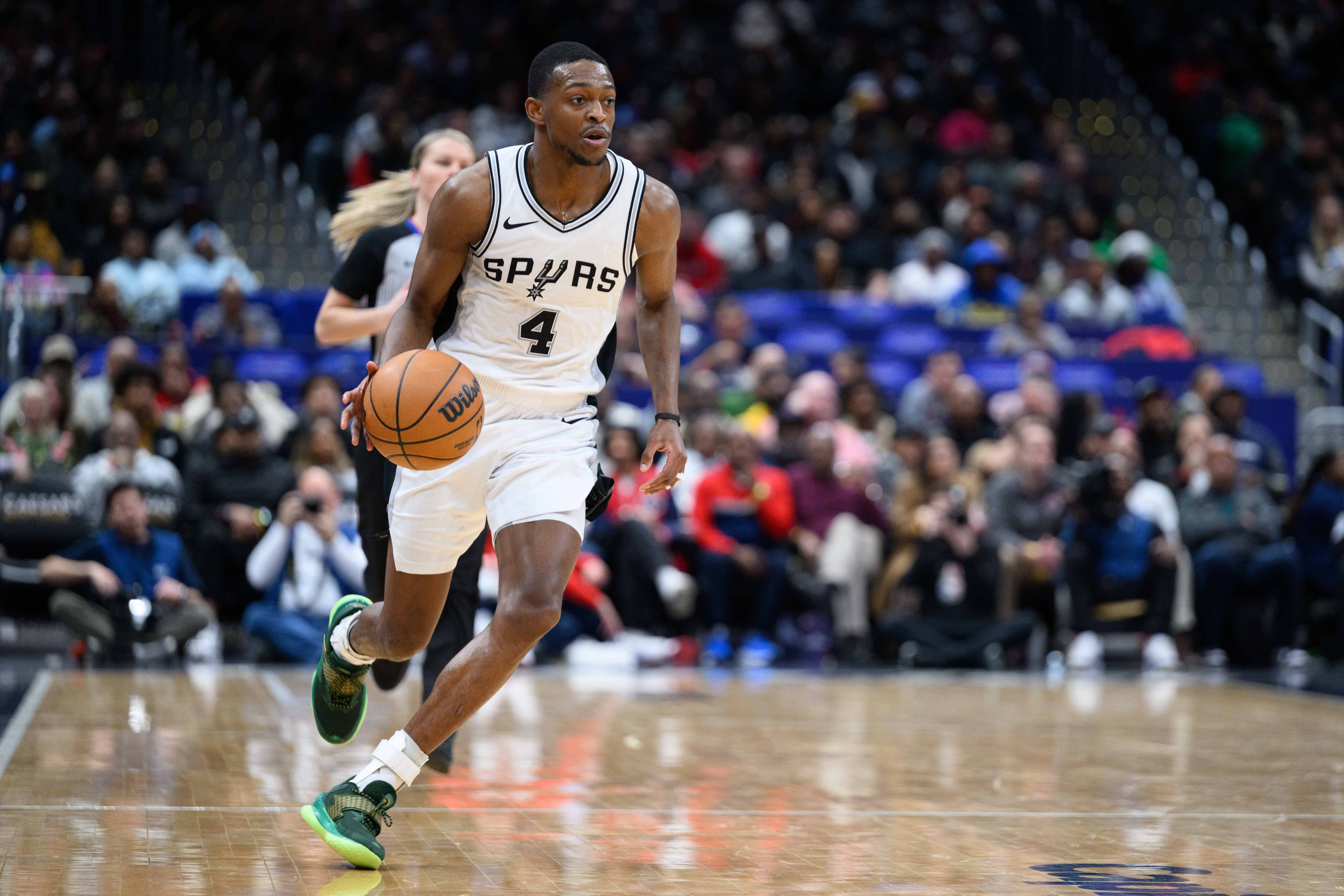 Feb 10, 2025; Washington, District of Columbia, USA; San Antonio Spurs guard De'Aaron Fox (4) handles the ball during the third quarter against the Washington Wizards at Capital One Arena. Mandatory Credit: Reggie Hildred-Imagn Images  