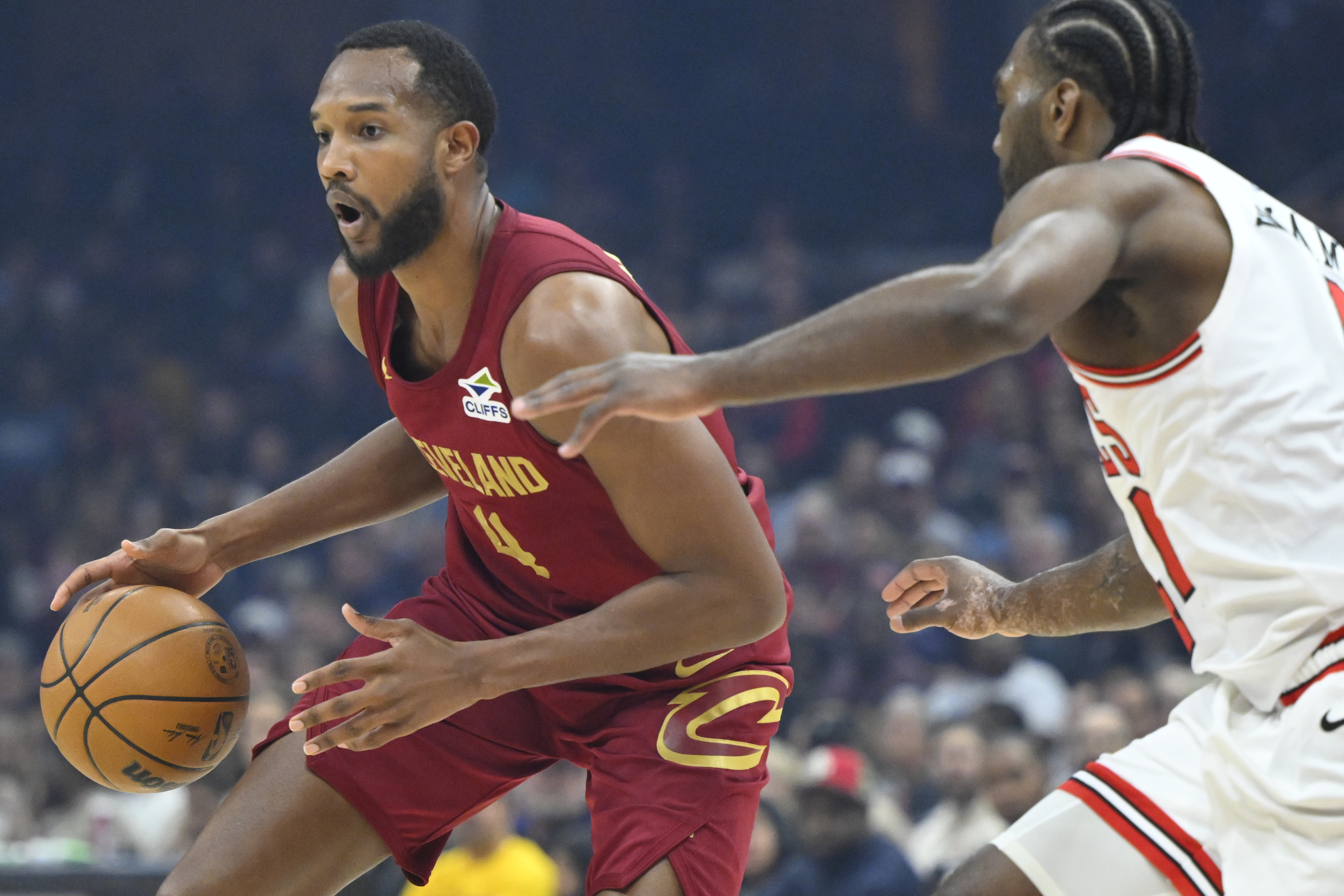 Apr 8, 2025; Cleveland, Ohio, USA; Cleveland Cavaliers forward Evan Mobley (4) dribbles beside Chicago Bulls forward Patrick Williams (44) in the first quarter at Rocket Arena. Mandatory Credit: David Richard-Imagn Images  