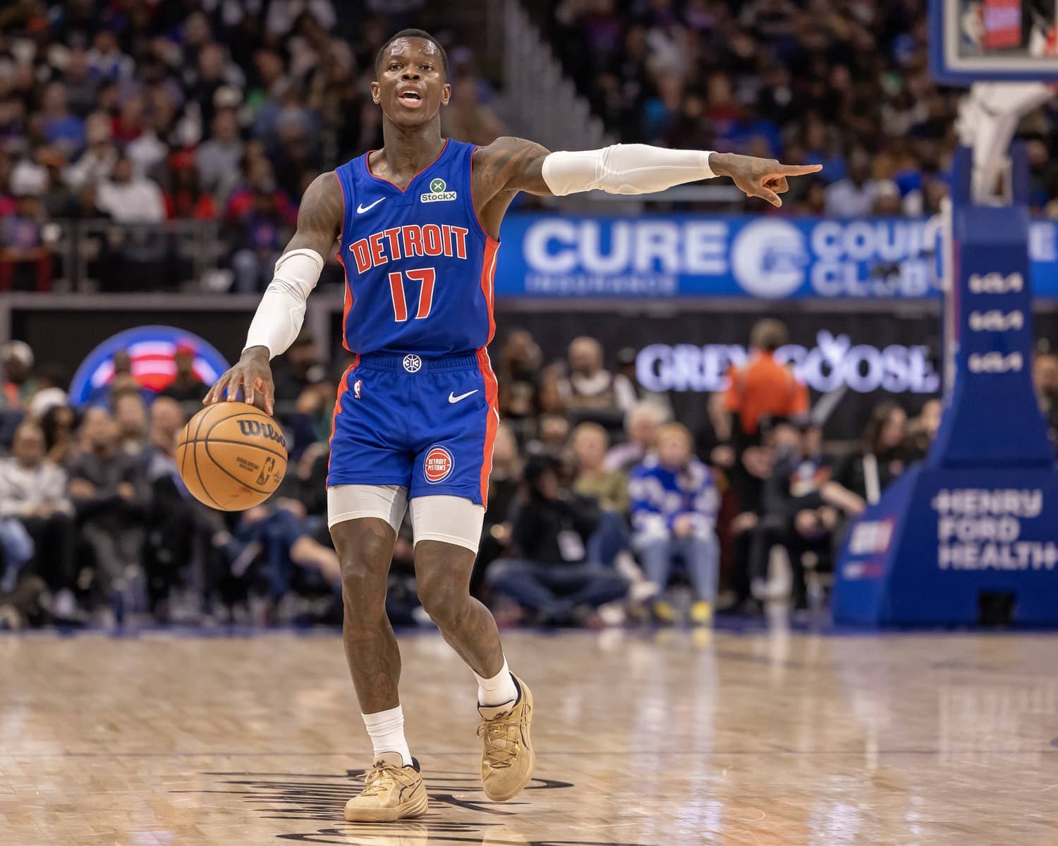 Detroit, Michigan, USA; Detroit Pistons guard Dennis Schroder (17) moves the ball up court and directs a play against the New York Knicks during the second half at Little Caesars Arena. Mandatory Credit: David Reginek-Imagn Images