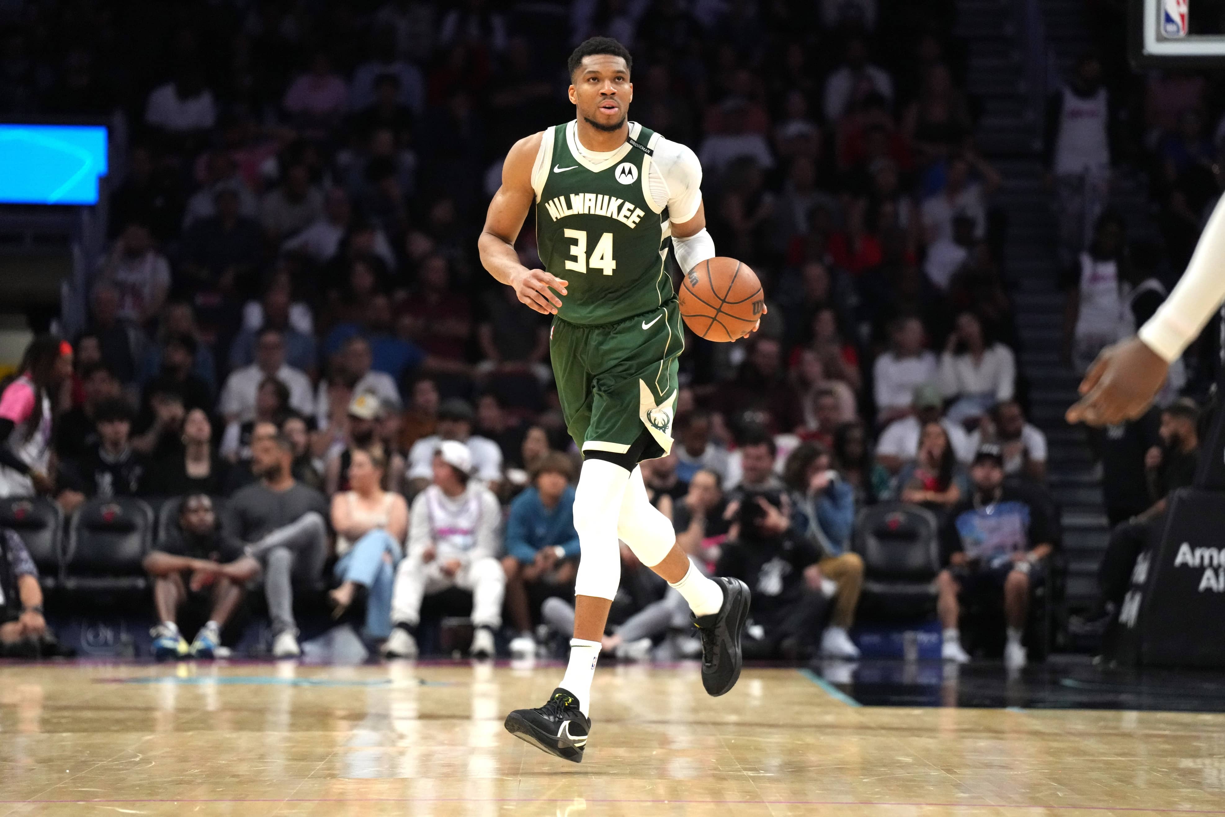 Milwaukee Bucks forward Giannis Antetokounmpo (34) brings the ball up the court against the Miami Heat during overtime at Kaseya Center. Mandatory Credit: Jim Rassol-Imagn Images