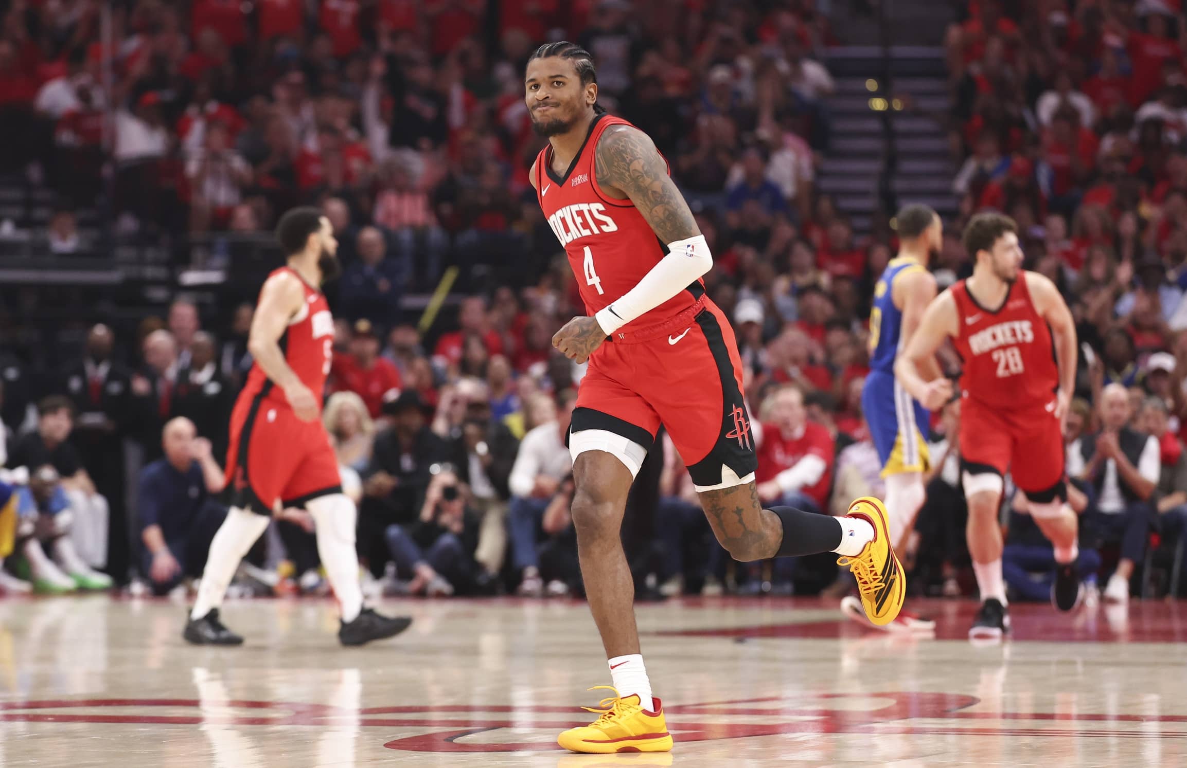 Houston, Texas, USA; Houston Rockets guard Jalen Green (4) reacts after making a basket during game two of the first round for the 2024 NBA Playoffs against the Golden State Warriors at Toyota Center. Mandatory Credit: Troy Taormina-Imagn Images