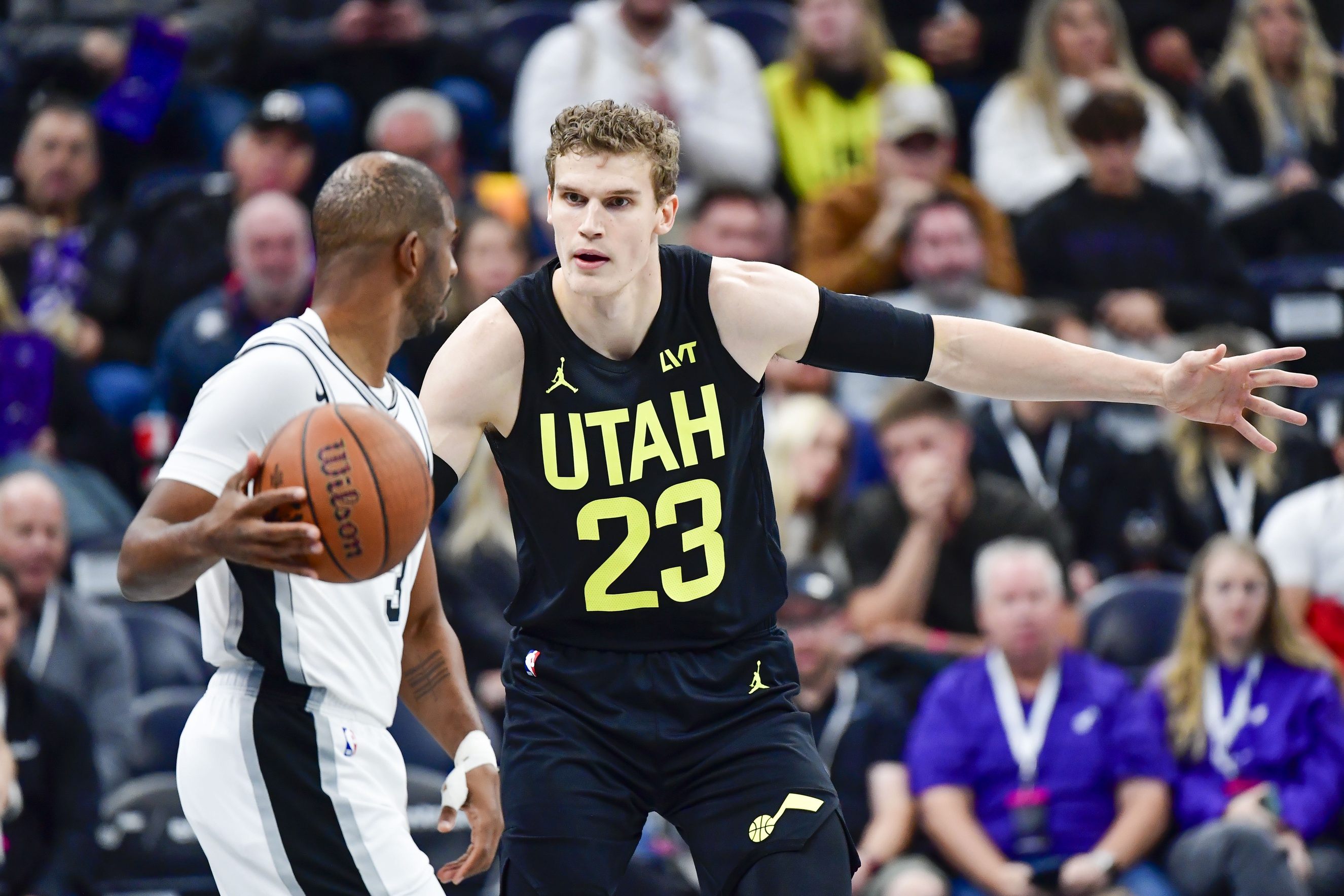 San Antonio Spurs guard Chris Paul (3) dribbles the ball around Utah Jazz forward/center Lauri Markkanen (23) during the first half at the Delta Center. Mandatory Credit: Christopher Creveling-Imagn Images