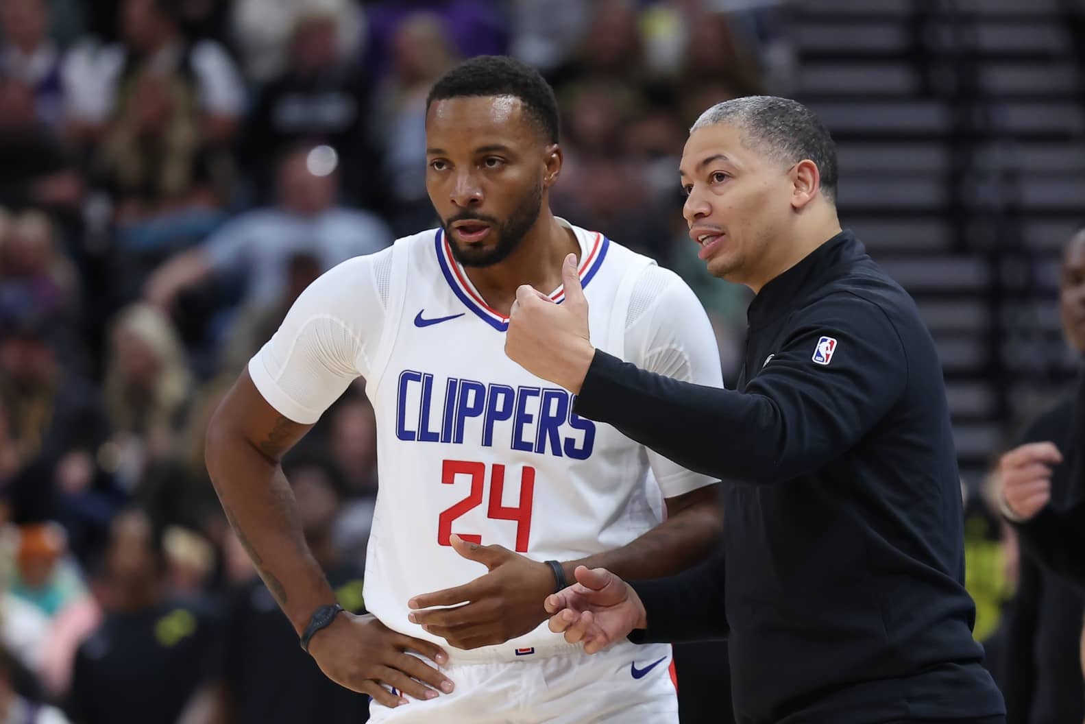Salt Lake City, Utah, USA; Los Angeles Clippers guard Norman Powell (24) and head coach Tyronn Lue speak during a break in action against the Utah Jazz in the second half at Delta Center. Mandatory Credit: Rob Gray-Imagn Images