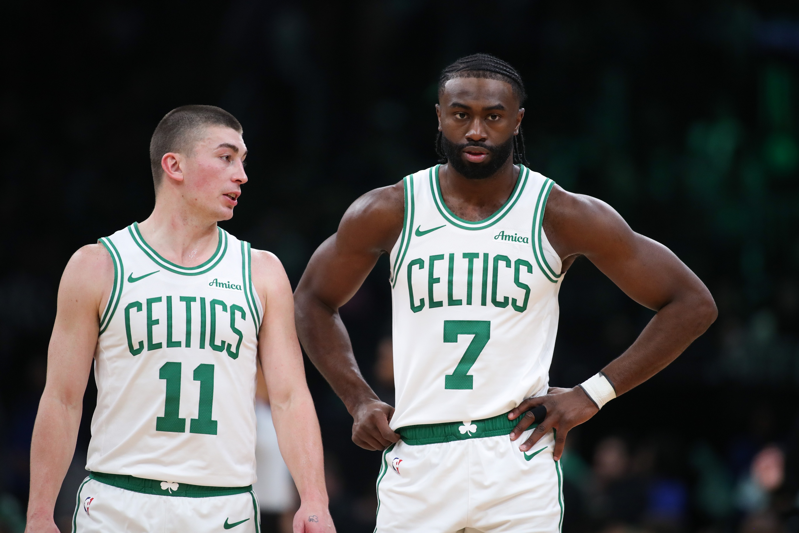 Boston Celtics forward Jaylen Brown (7) and Boston Celtics guard Payton Pritchard (11) talk during the first half against the Memphis Grizzlies at TD Garden. Mandatory Credit: Paul Rutherford-Imagn Images