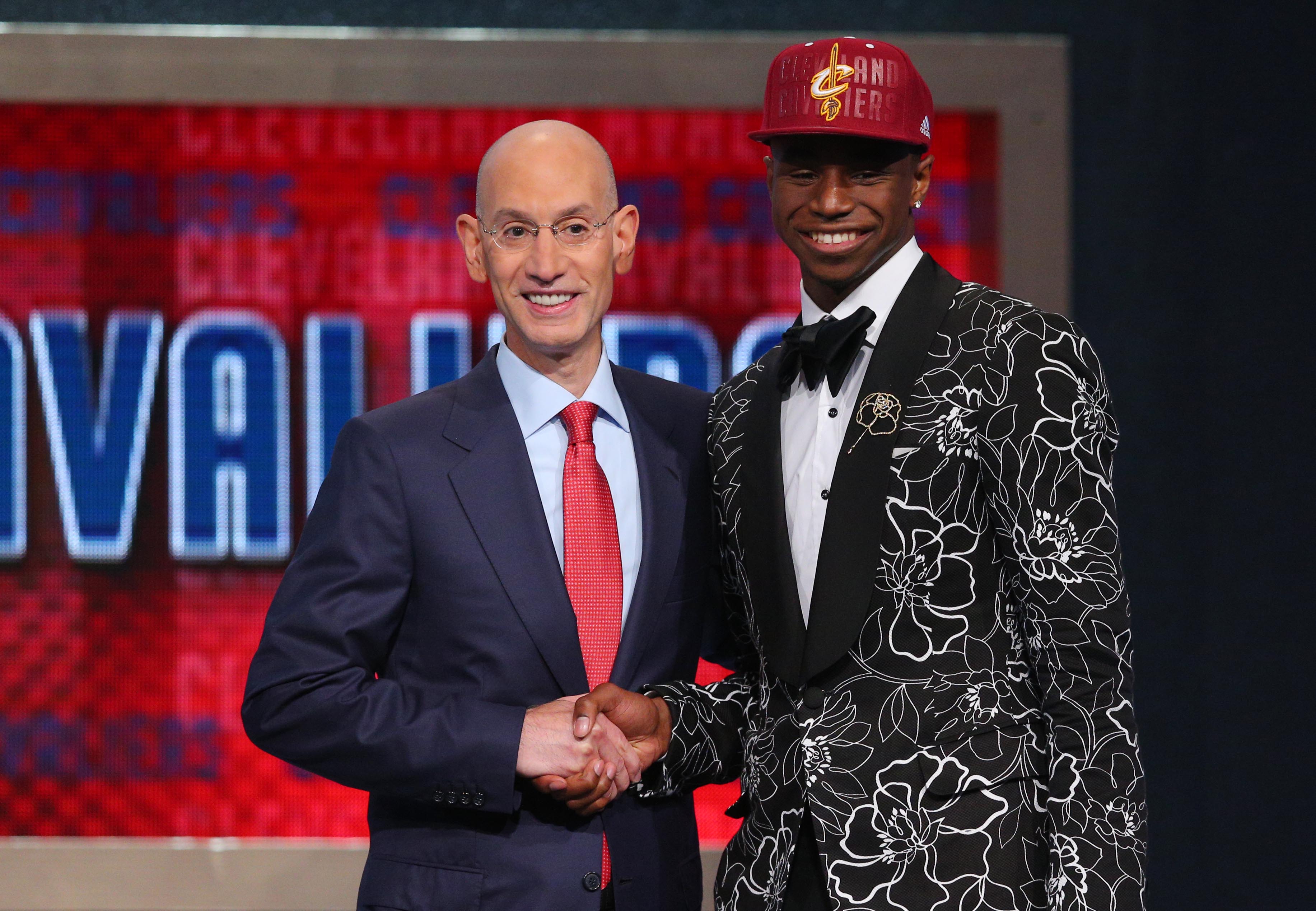Jun 26, 2014; Brooklyn, NY, USA; Andrew Wiggins (Kansas) shakes hands with NBA commissioner Adam Silver after being selected as the number one overall pick to the Cleveland Cavaliers in the 2014 NBA Draft at the Barclays Center. Mandatory Credit: Brad Penner-Imagn Images  