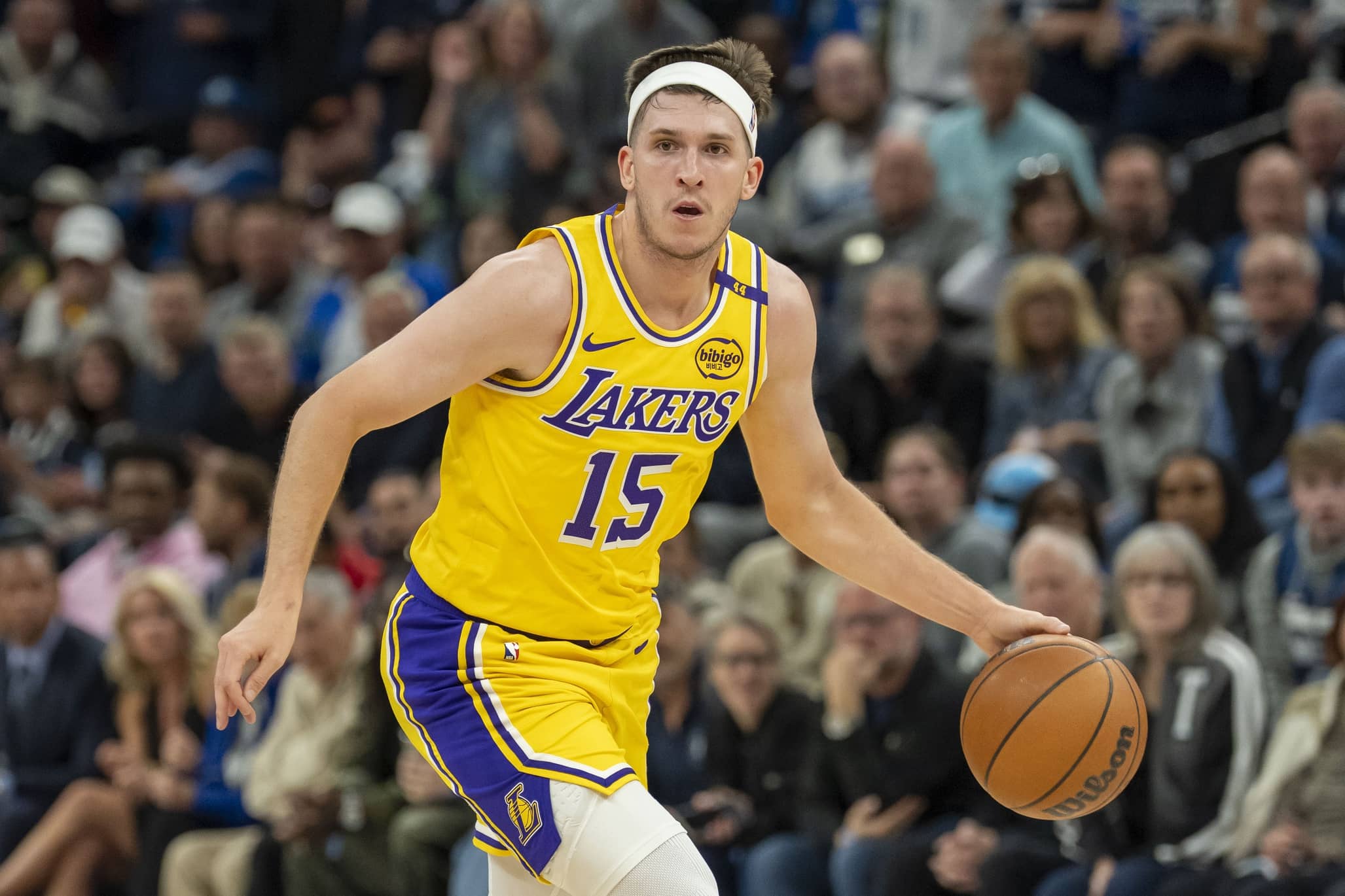 Apr 25, 2025; Minneapolis, Minnesota, USA; Los Angeles Lakers guard Austin Reaves (15) dribbles the ball against the Minnesota Timberwolves during game three of first round for the 2024 NBA Playoffs at Target Center. Mandatory Credit: Jesse Johnson-Imagn Images
