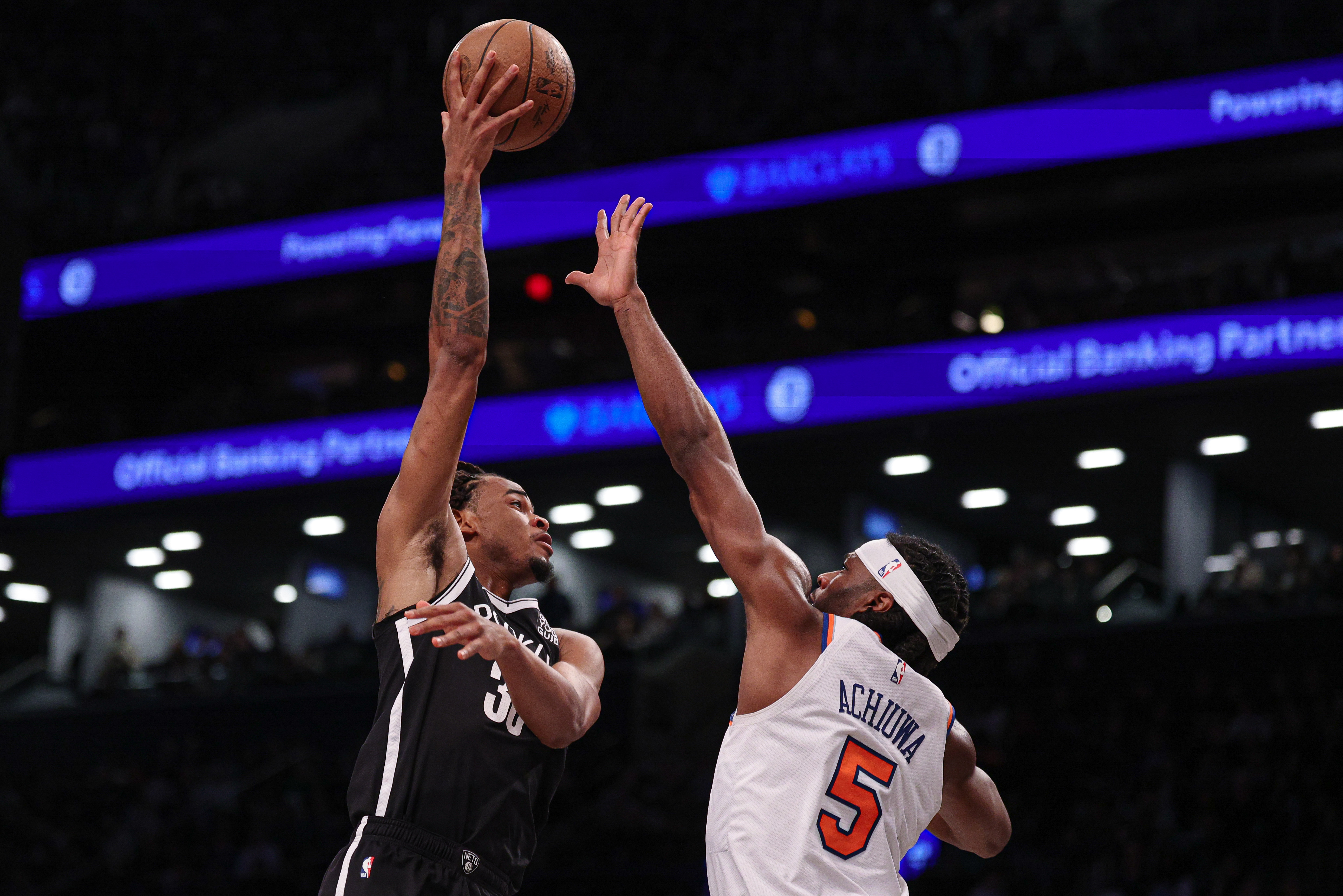 Apr 13, 2025; Brooklyn, New York, USA; Brooklyn Nets center Nic Claxton (33) shoots the ball as New York Knicks forward Precious Achiuwa (5) defends during the second half at Barclays Center. Mandatory Credit: Vincent Carchietta-Imagn Images  