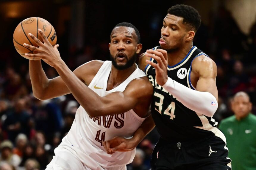 Cleveland Cavaliers forward Evan Mobley (4) drives to the basket against Milwaukee Bucks forward Giannis Antetokounmpo (34) during the second half at Rocket Mortgage FieldHouse.