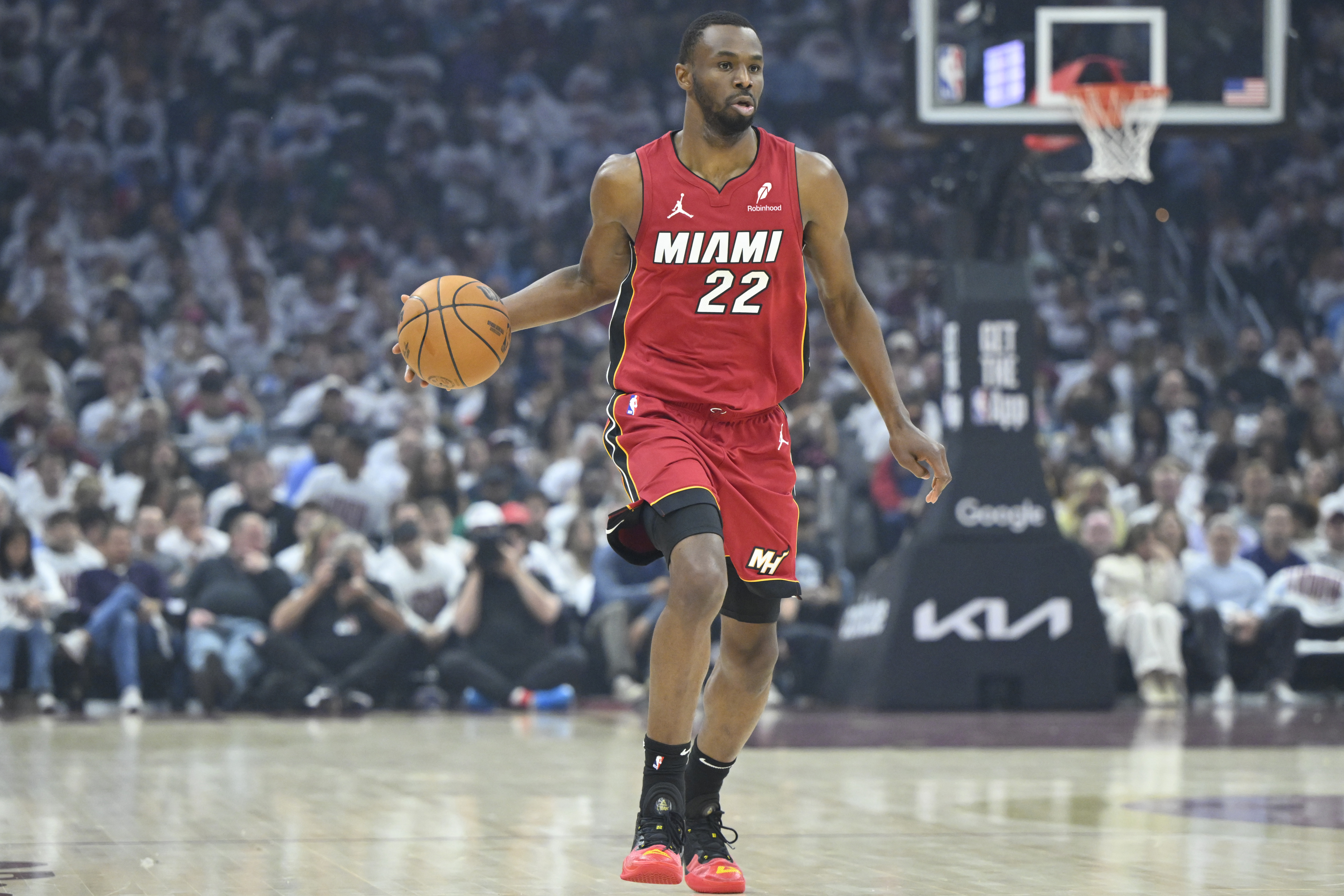 Apr 20, 2025; Cleveland, Ohio, USA; Miami Heat forward Andrew Wiggins (22) brings the ball up court in the first quarter against the Cleveland Cavaliers at Rocket Arena. Mandatory Credit: David Richard-Imagn Images  