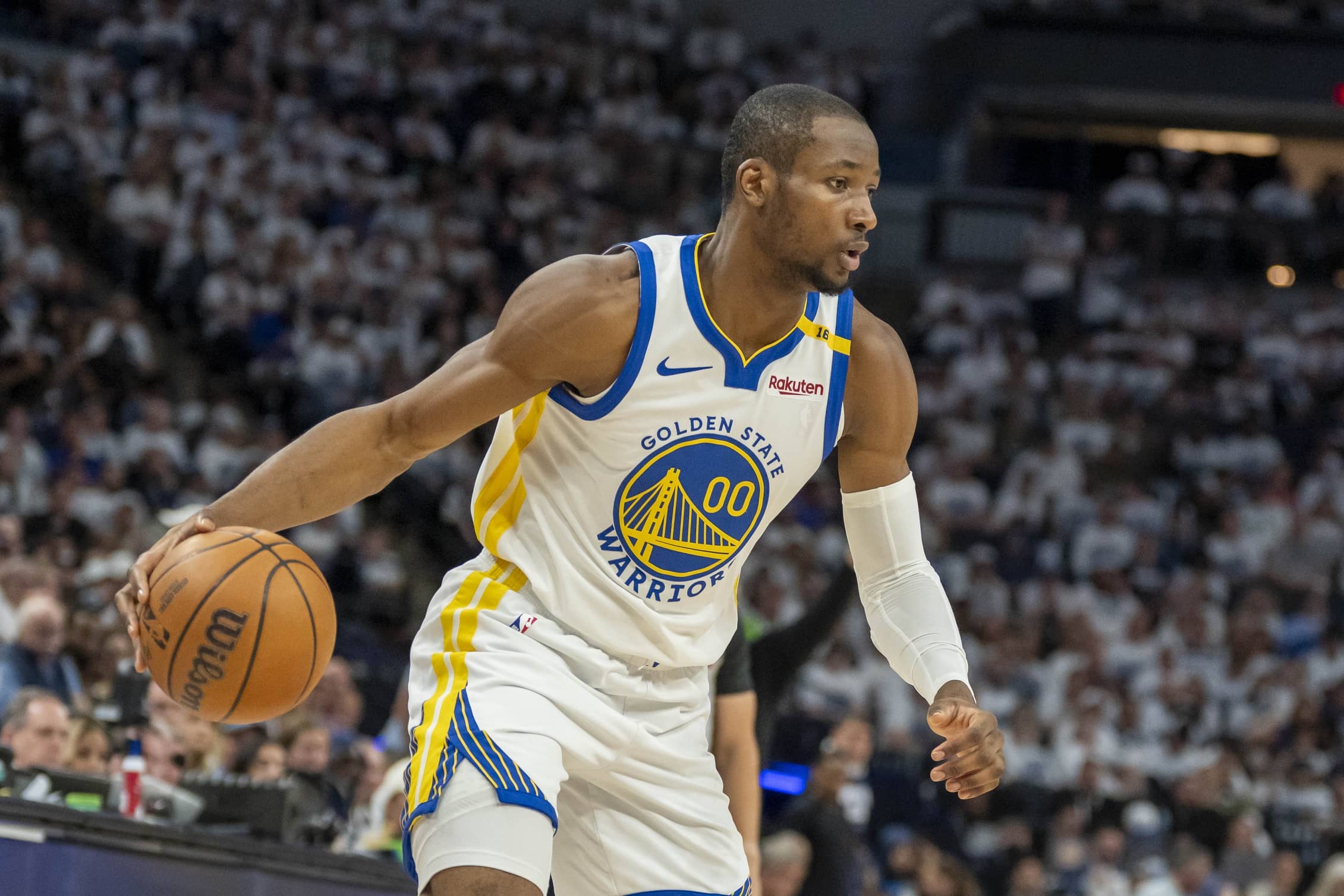 Golden State Warriors forward Jonathan Kuminga (00) dribbles the ball against the Minnesota Timberwolves in the second half during game two of the second round for the 2025 NBA Playoffs at Target Center.