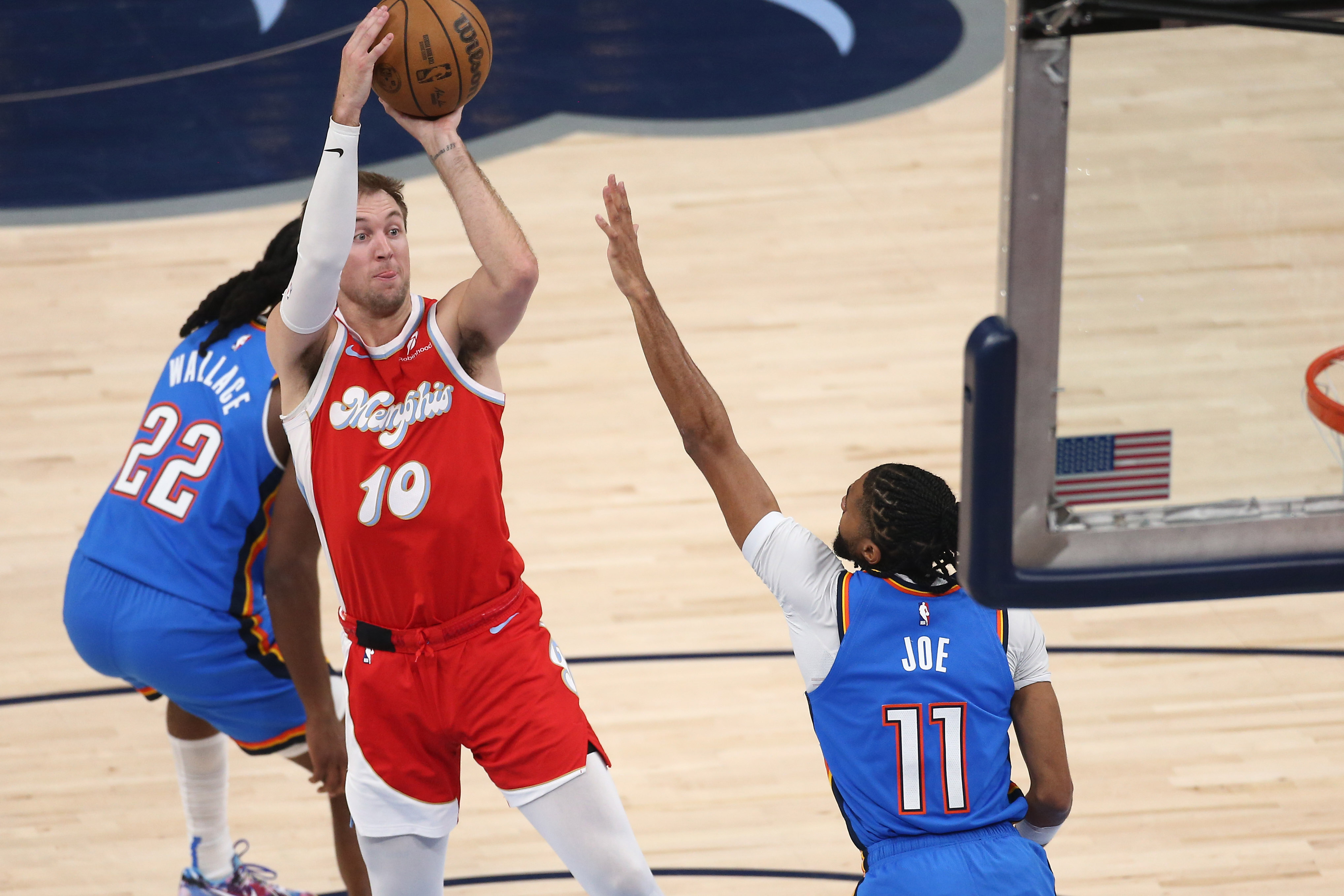 Apr 26, 2025; Memphis, Tennessee, USA; Memphis Grizzlies guard Luke Kennard (10) shoots as Oklahoma City Thunder guard Isaiah Joe (11) defends during the second quarter during game four for the first round of the 2024 NBA Playoffs at FedExForum. Mandatory Credit: Petre Thomas-Imagn Images