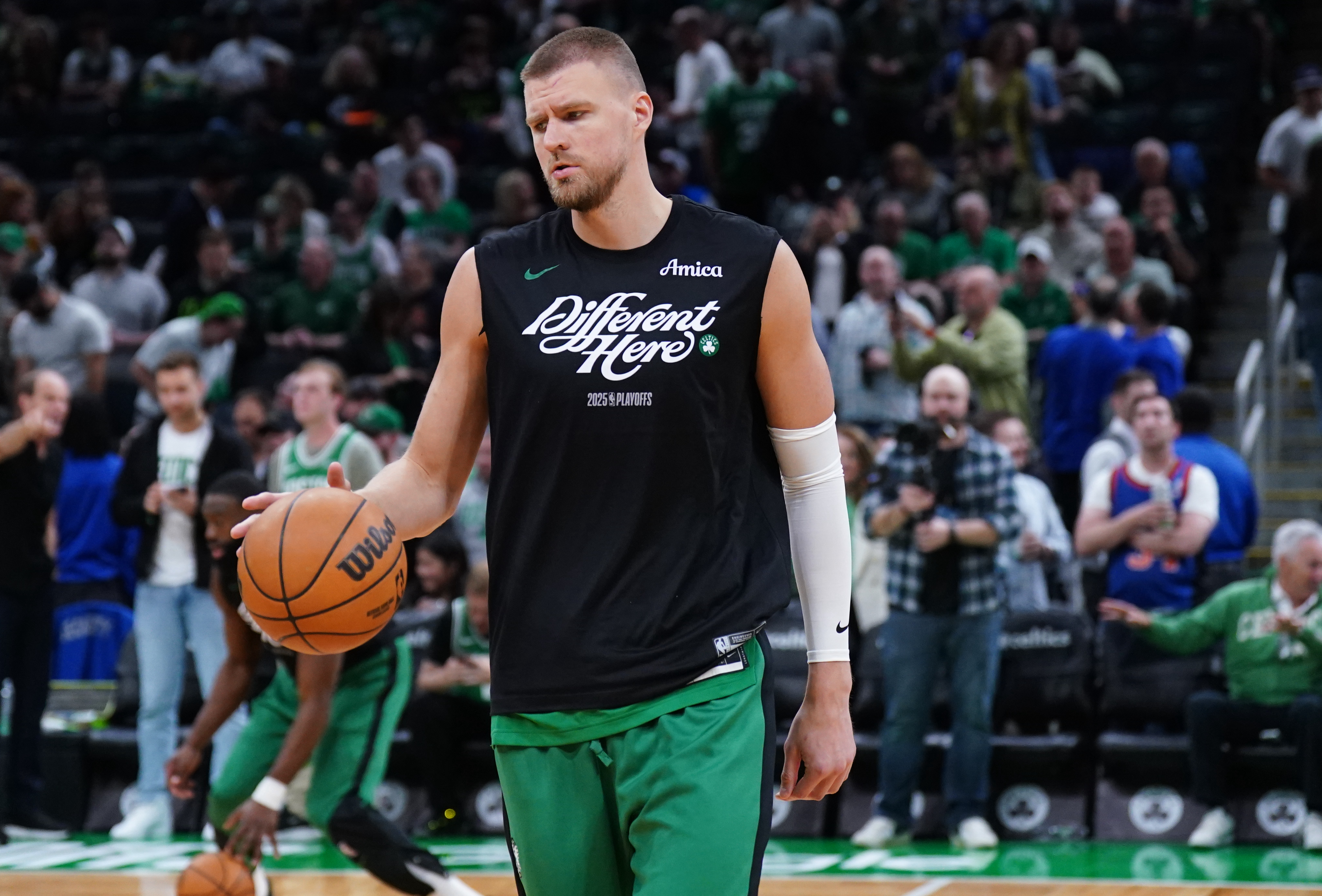 May 7, 2025; Boston, Massachusetts, USA; Boston Celtics center Kristaps Porzingis (8) warms up before the start of game two of the second round for the 2025 NBA Playoffs against the New York Knicks at TD Garden. Mandatory Credit: David Butler II-Imagn Images  