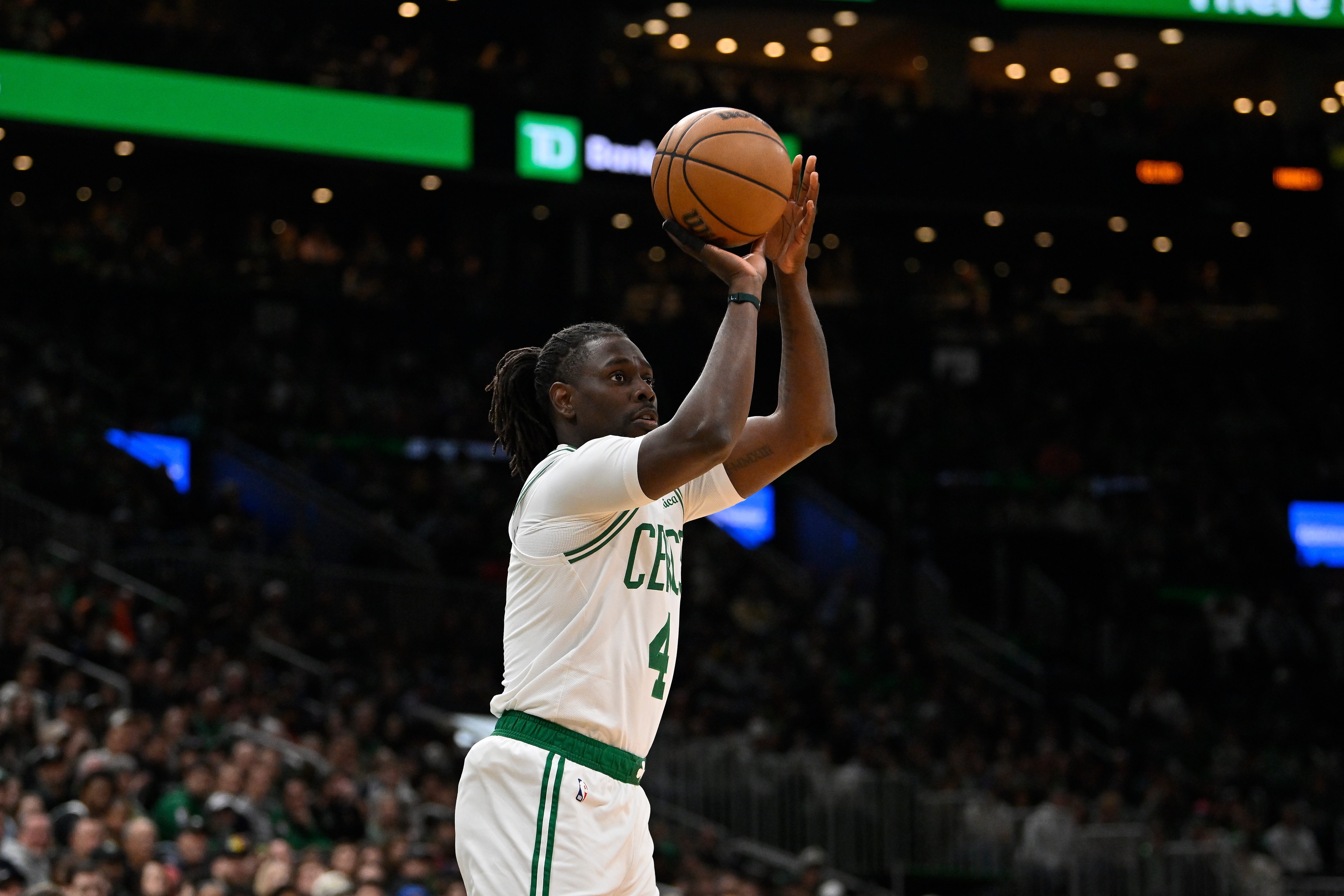 Apr 11, 2025; Boston, Massachusetts, USA; Boston Celtics guard Jrue Holiday (4) shoots the ball against the Charlotte Hornets during the first half at TD Garden. Mandatory Credit: Eric Canha-Imagn Images  