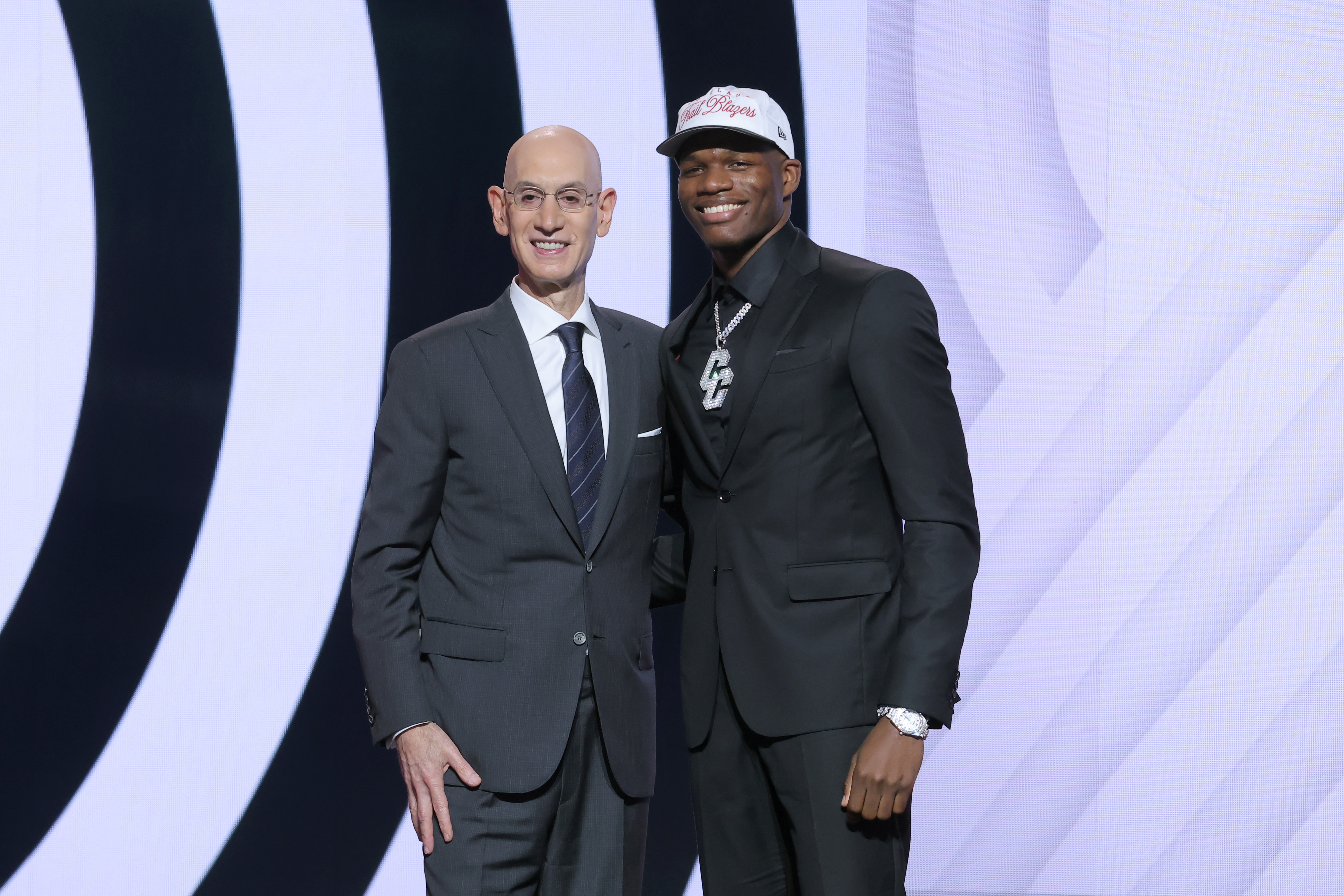 Jun 25, 2025; Brooklyn, NY, USA; Cedric Coward stands with NBA commissioner Adam Silver after being selected as the 11th pick by the Portland Trail Blazers in the first round of the 2025 NBA Draft at Barclays Center. Mandatory Credit: Brad Penner-Imagn Images  