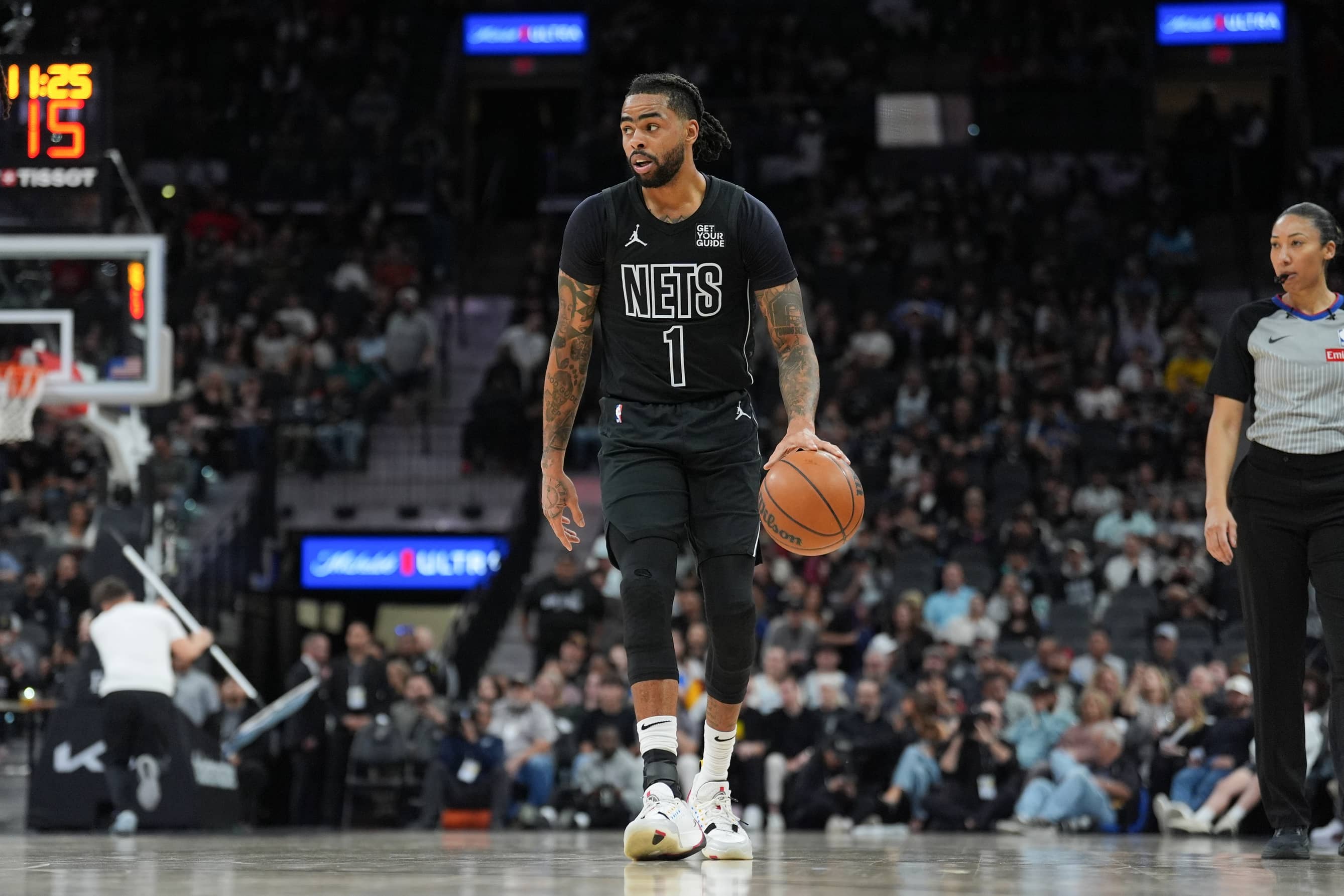San Antonio, Texas, USA; Brooklyn Nets guard D'Angelo Russell (1) dribbles in the second half against the San Antonio Spurs at Frost Bank Center. Mandatory Credit: Daniel Dunn-Imagn Images