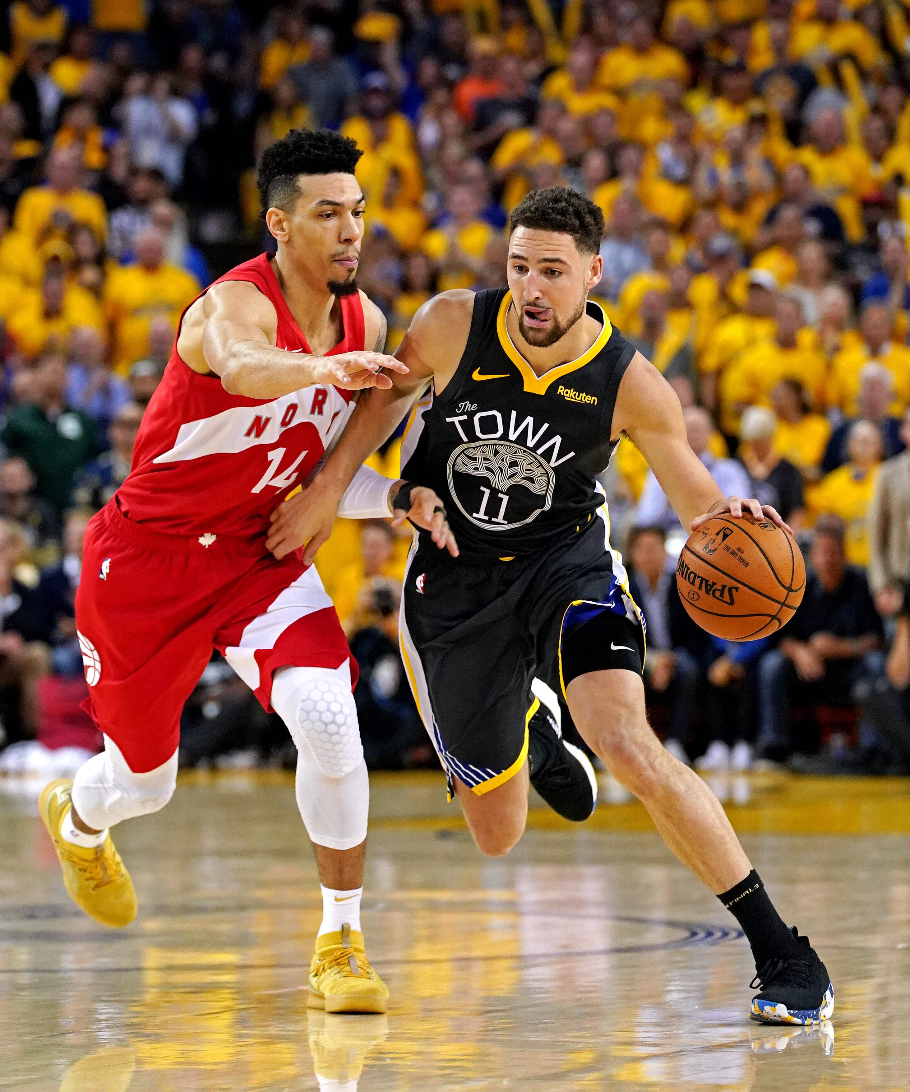 Jun 13, 2019; Oakland, CA, USA; Golden State Warriors guard Klay Thompson (11) drives to the basket against Toronto Raptors guard Danny Green (14) during the third quarter in game six of the 2019 NBA Finals at Oracle Arena. Mandatory Credit: Kyle Terada-Imagn Images  
