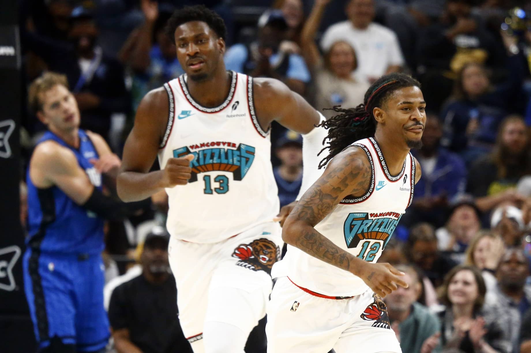 Memphis Grizzlies forward Jaren Jackson Jr. (13) and guard Ja Morant (12) get back on defense during the first half against the Orlando Magic at FedExForum.