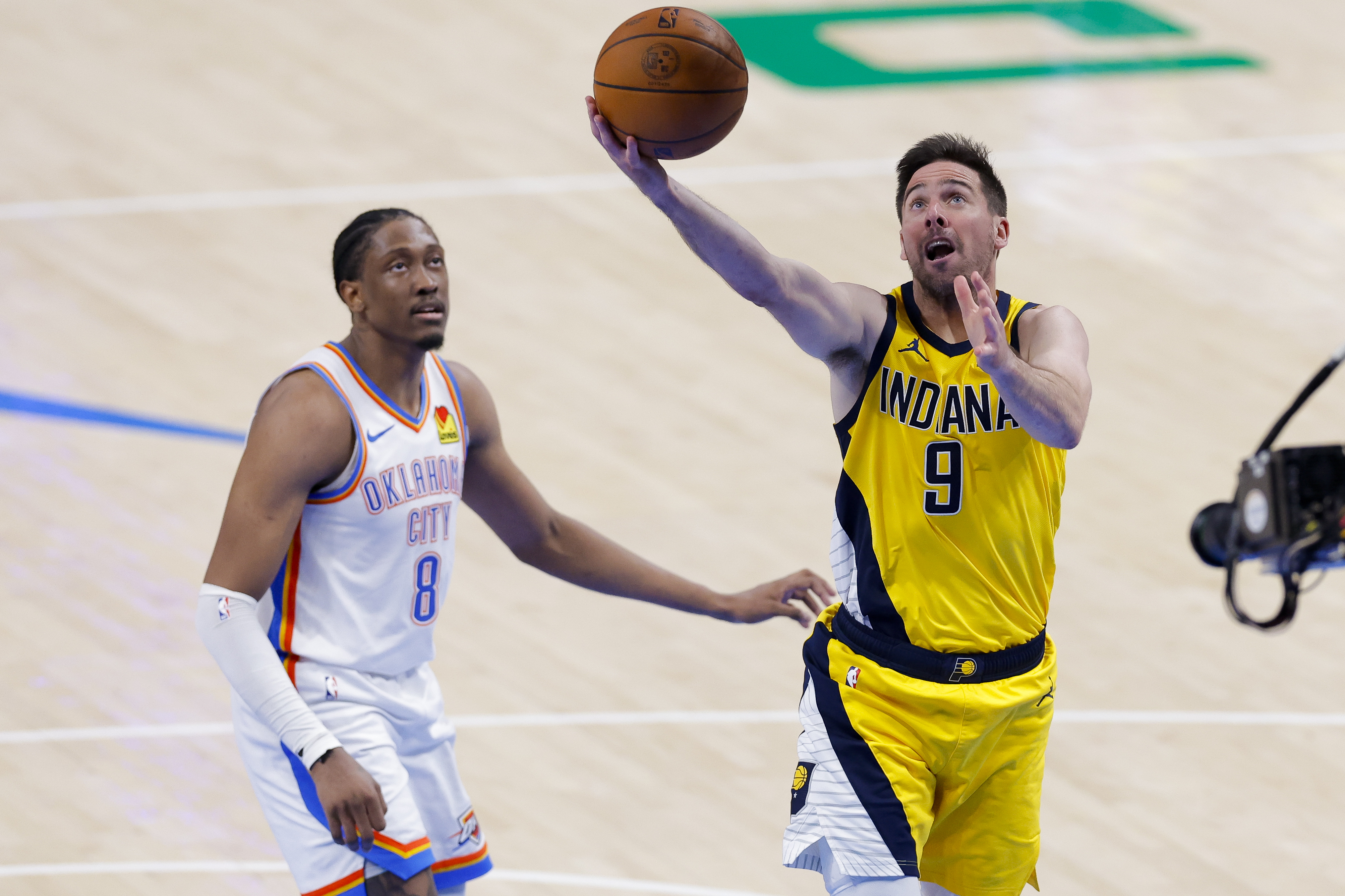 Jun 16, 2025; Oklahoma City, Oklahoma, USA; Indiana Pacers guard T.J. McConnell (9) drives to the basket past Oklahoma City Thunder forward Jalen Williams (8) during the third quarter in game five of the 2025 NBA Finals at Paycom Center. Mandatory Credit: Alonzo Adams-Imagn Images  