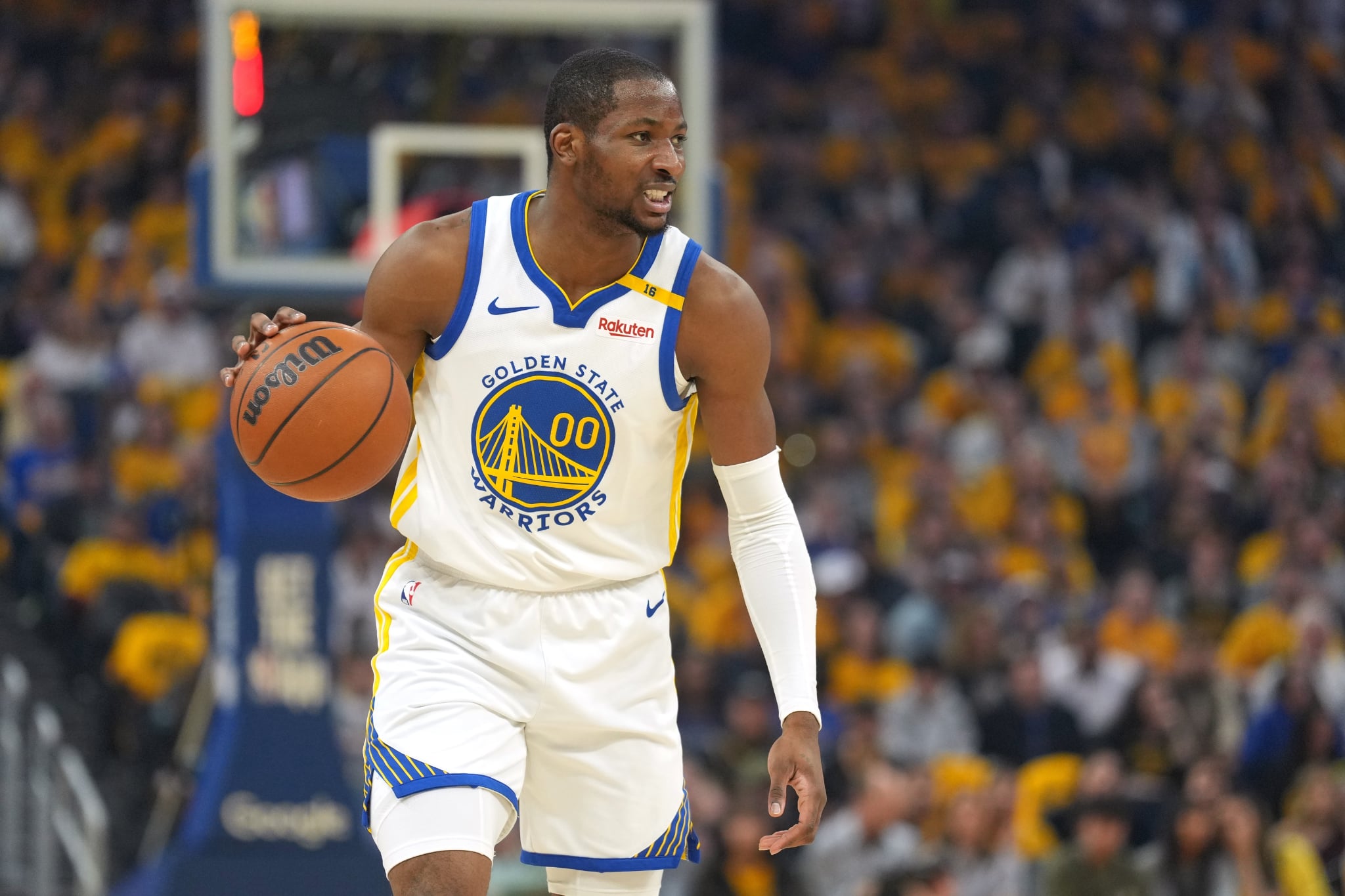 Apr 26, 2025; San Francisco, California, USA; Golden State Warriors forward Jonathan Kuminga (00) dribbles against the Houston Rockets during the first quarter of game three of first round for the 2024 NBA Playoffs at Chase Center. Mandatory Credit: Darren Yamashita-Imagn Images