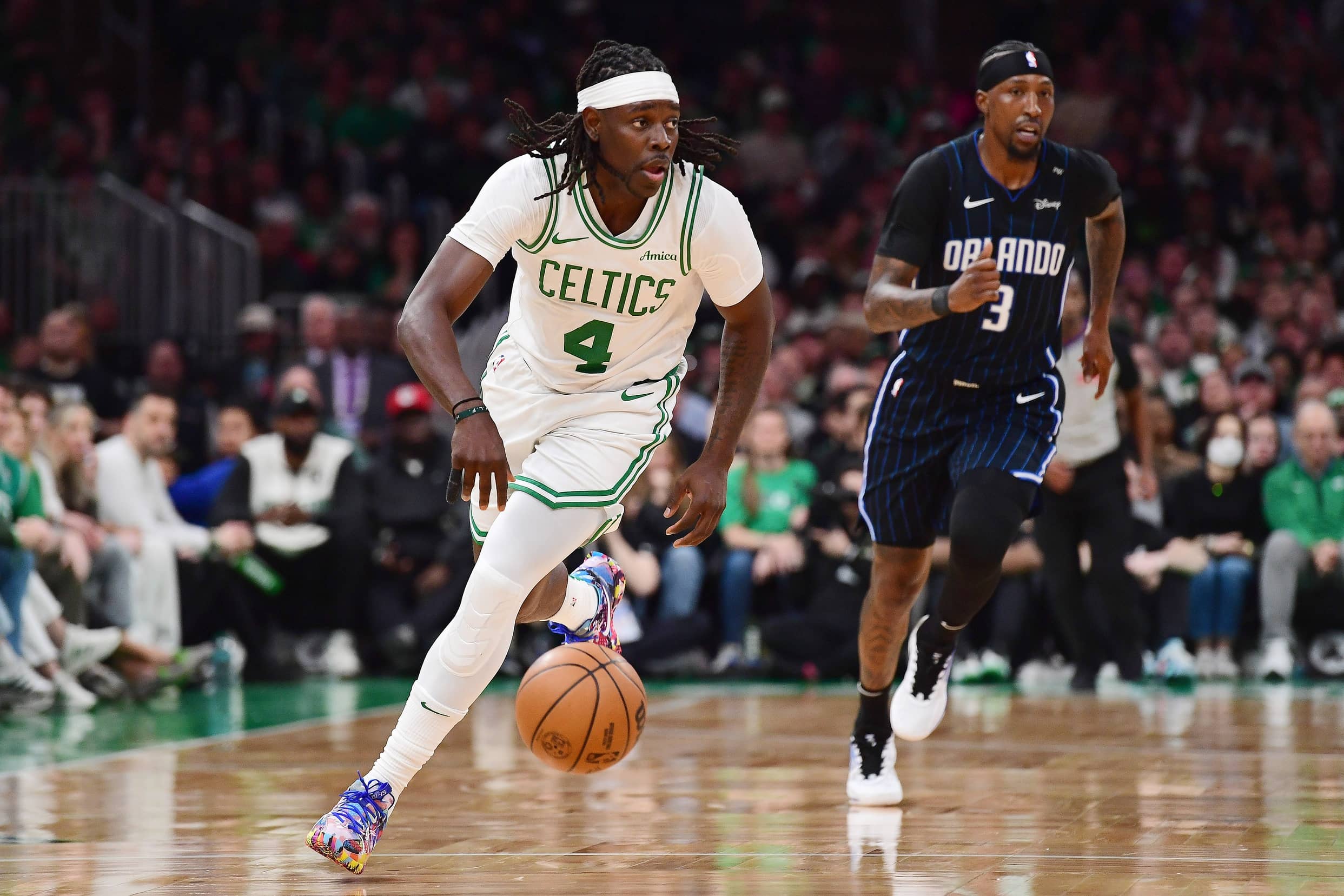 Apr 20, 2025; Boston, Massachusetts, USA; Boston Celtics guard Jrue Holiday (4) controls the ball during the second half against the Orlando Magic at TD Garden. Mandatory Credit: Bob DeChiara - Imagn Images