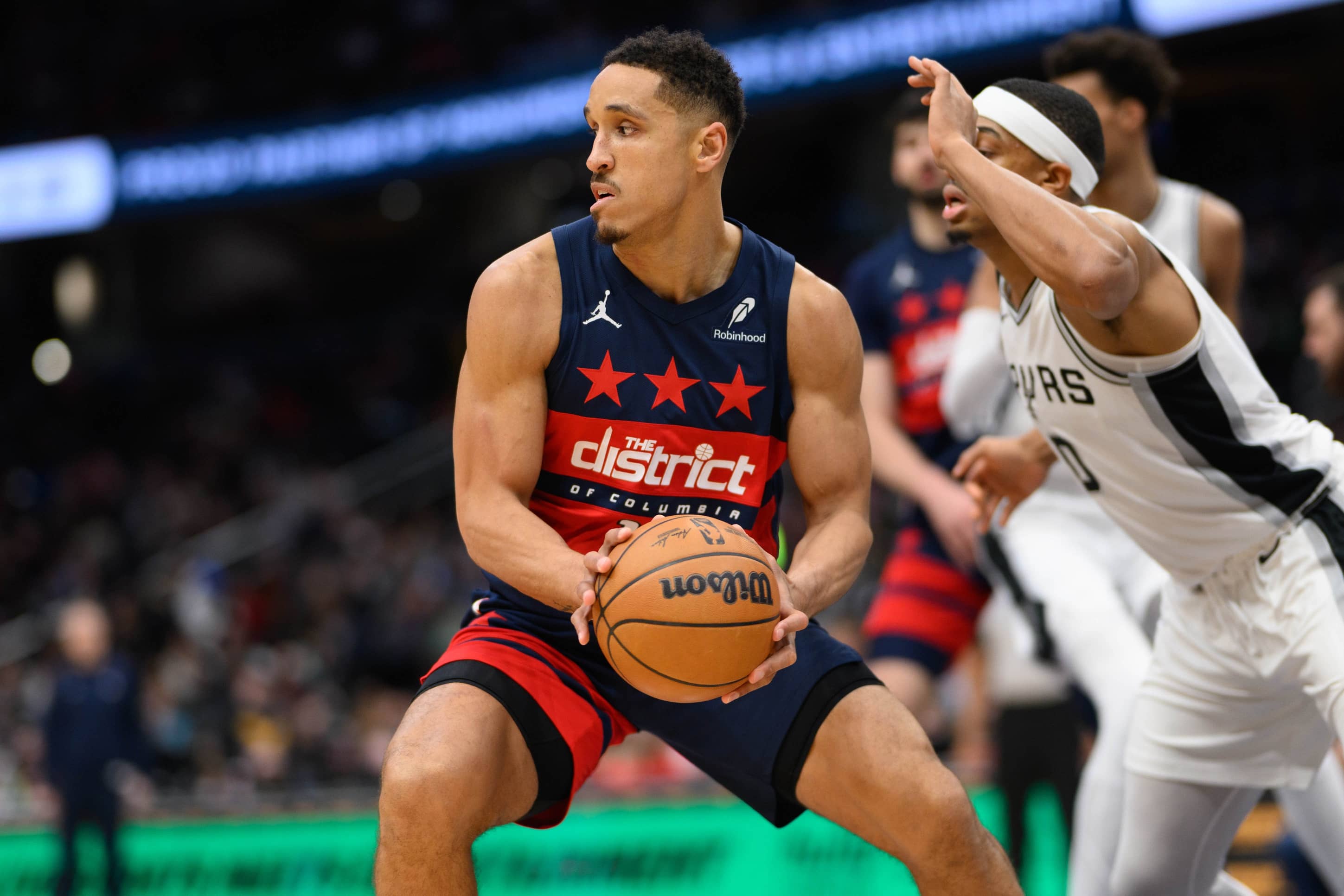 Feb 10, 2025; Washington, District of Columbia, USA; Washington Wizards guard Malcolm Brogdon (15) drives to the basket against San Antonio Spurs forward Keldon Johnson (0) during the second quarter at Capital One Arena. Mandatory Credit: Reggie Hildred-Imagn Images