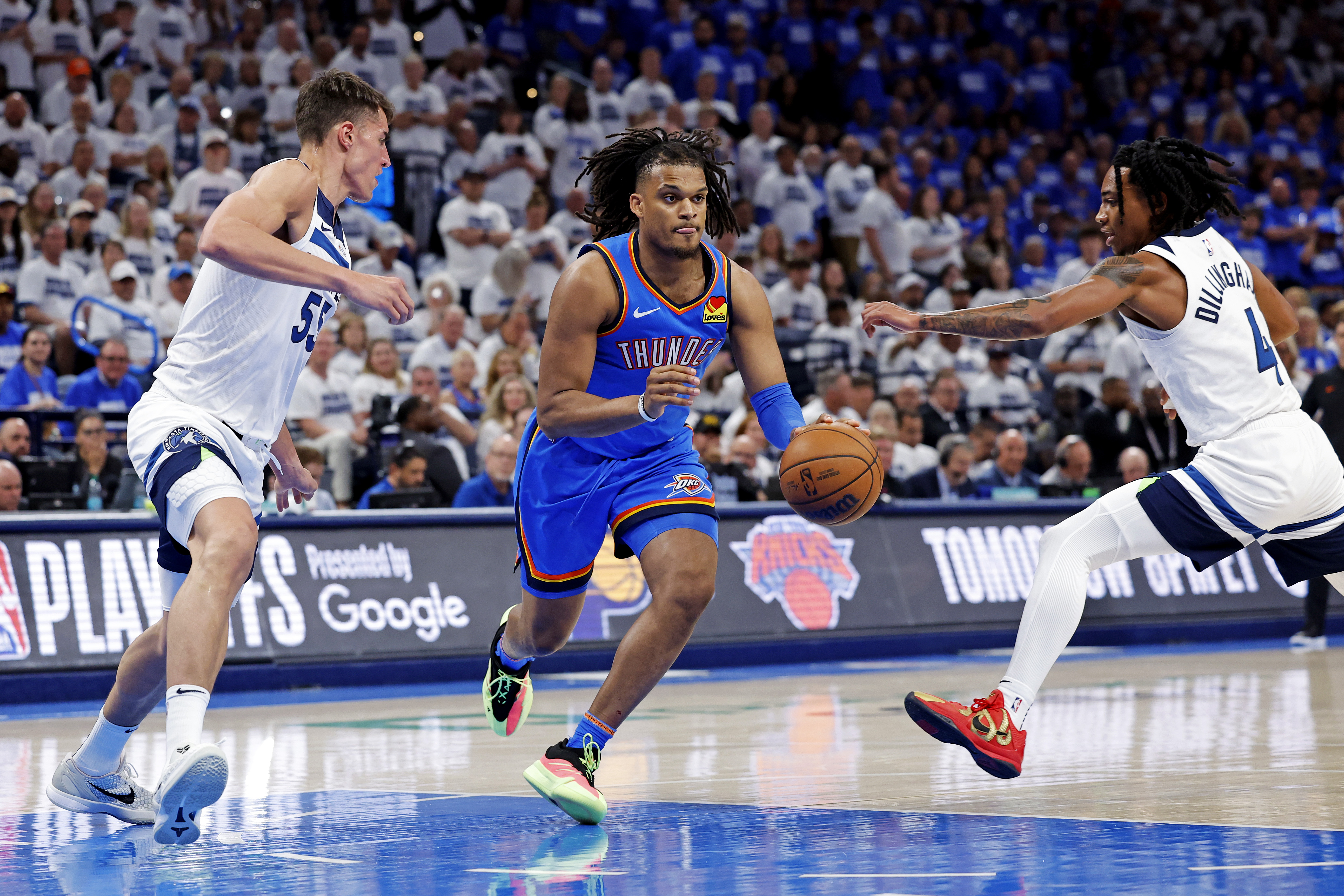 May 28, 2025; Oklahoma City, Oklahoma, USA; Oklahoma City Thunder forward Dillon Jones (3) drives to the basket against Minnesota Timberwolves center Luka Garza (55) and guard Rob Dillingham (4) during the fourth quarter in game five of the western conference finals for the 2025 NBA Playoffs at Paycom Center. Mandatory Credit: Alonzo Adams-Imagn Images