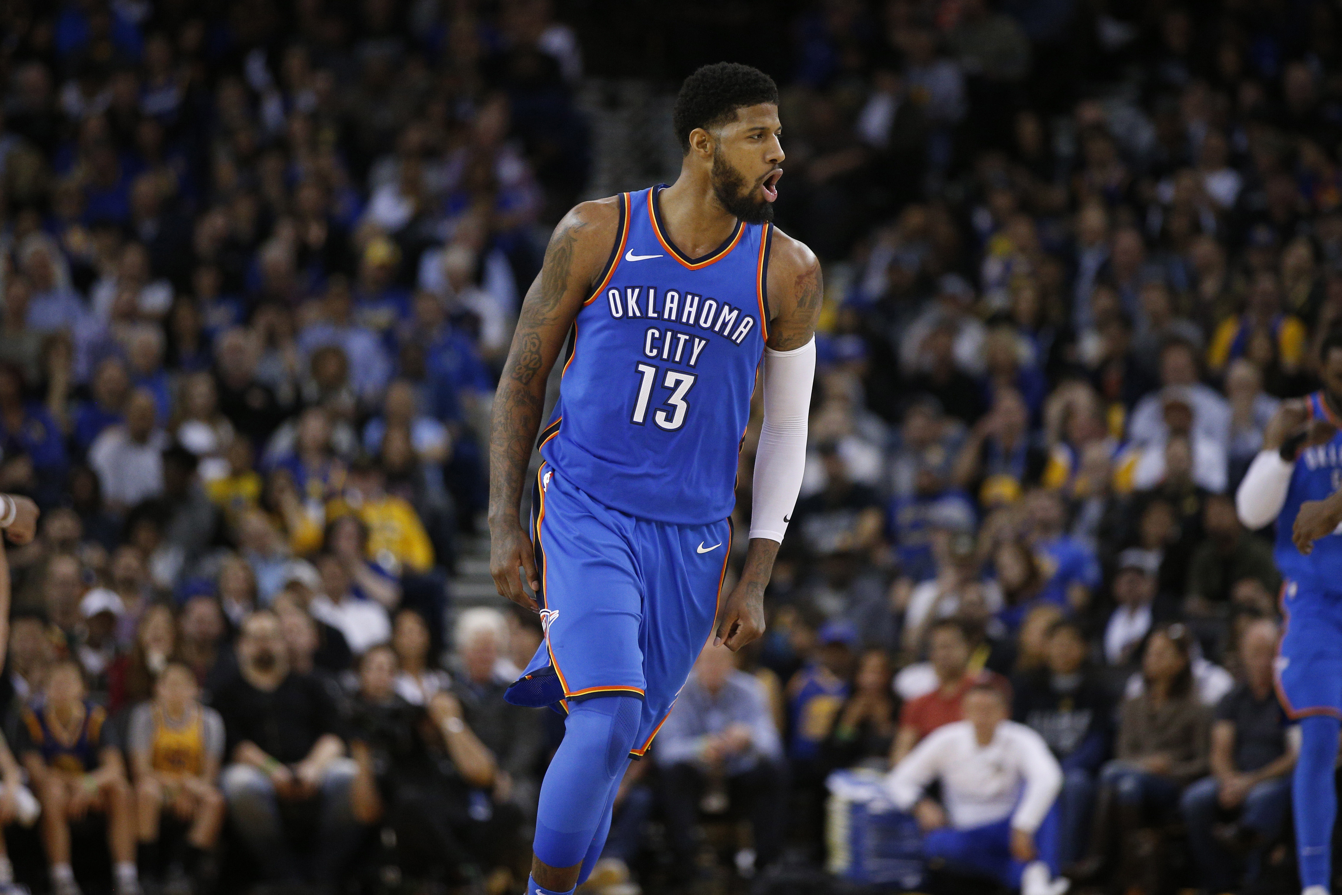 Feb 6, 2018; Oakland, CA, USA; Oklahoma City Thunder forward Paul George (13) reacts after making a three point basket against the Golden State Warriors in the third quarter at Oracle Arena. Mandatory Credit: Cary Edmondson-Imagn Images  