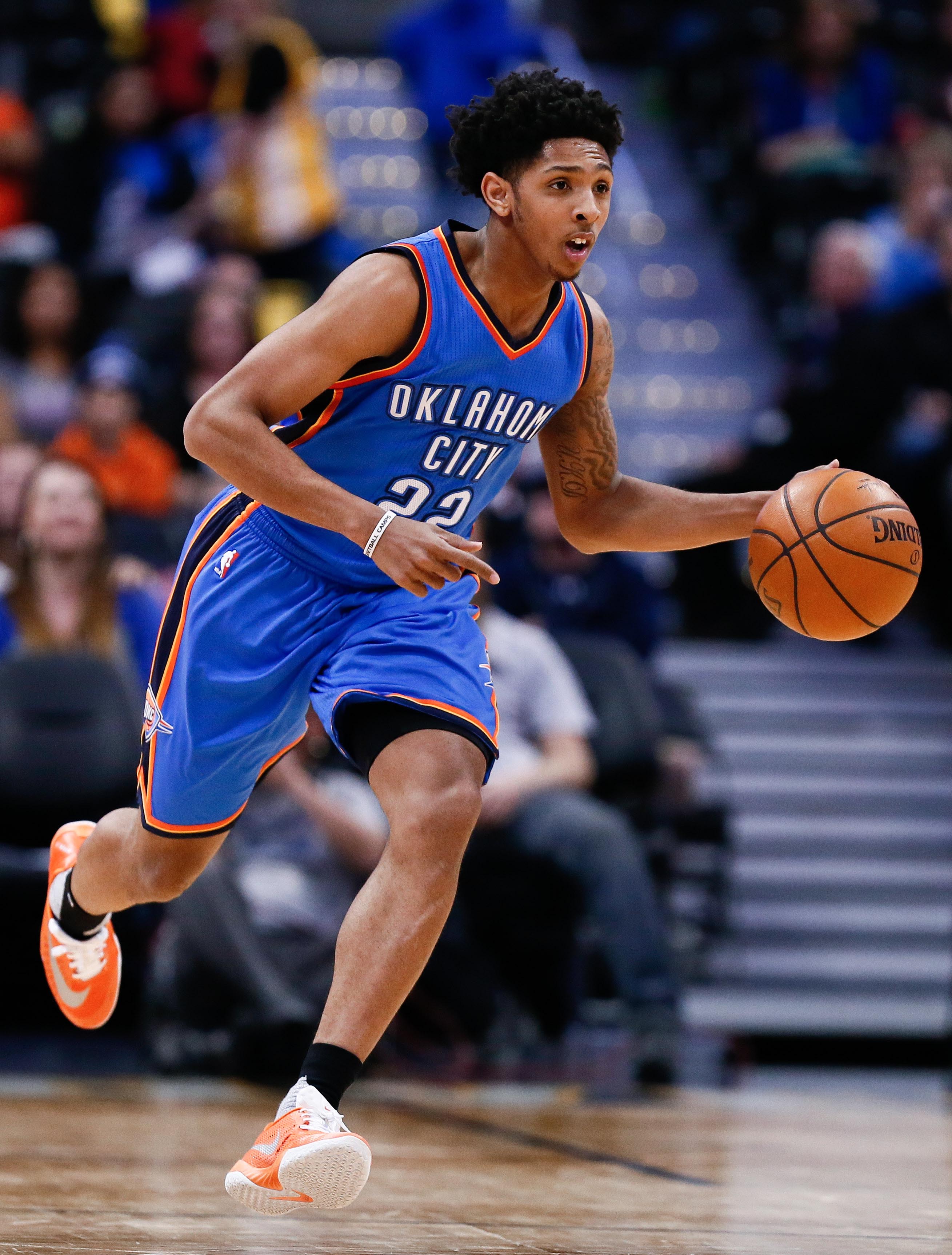 Apr 5, 2016; Denver, CO, USA; Oklahoma City Thunder guard Cameron Payne (22) dribbles the ball up court in the fourth quarter against the Denver Nuggets at the Pepsi Center. The Thunder defeated the Nuggets 124-102. Mandatory Credit: Isaiah J. Downing-Imagn Images  
