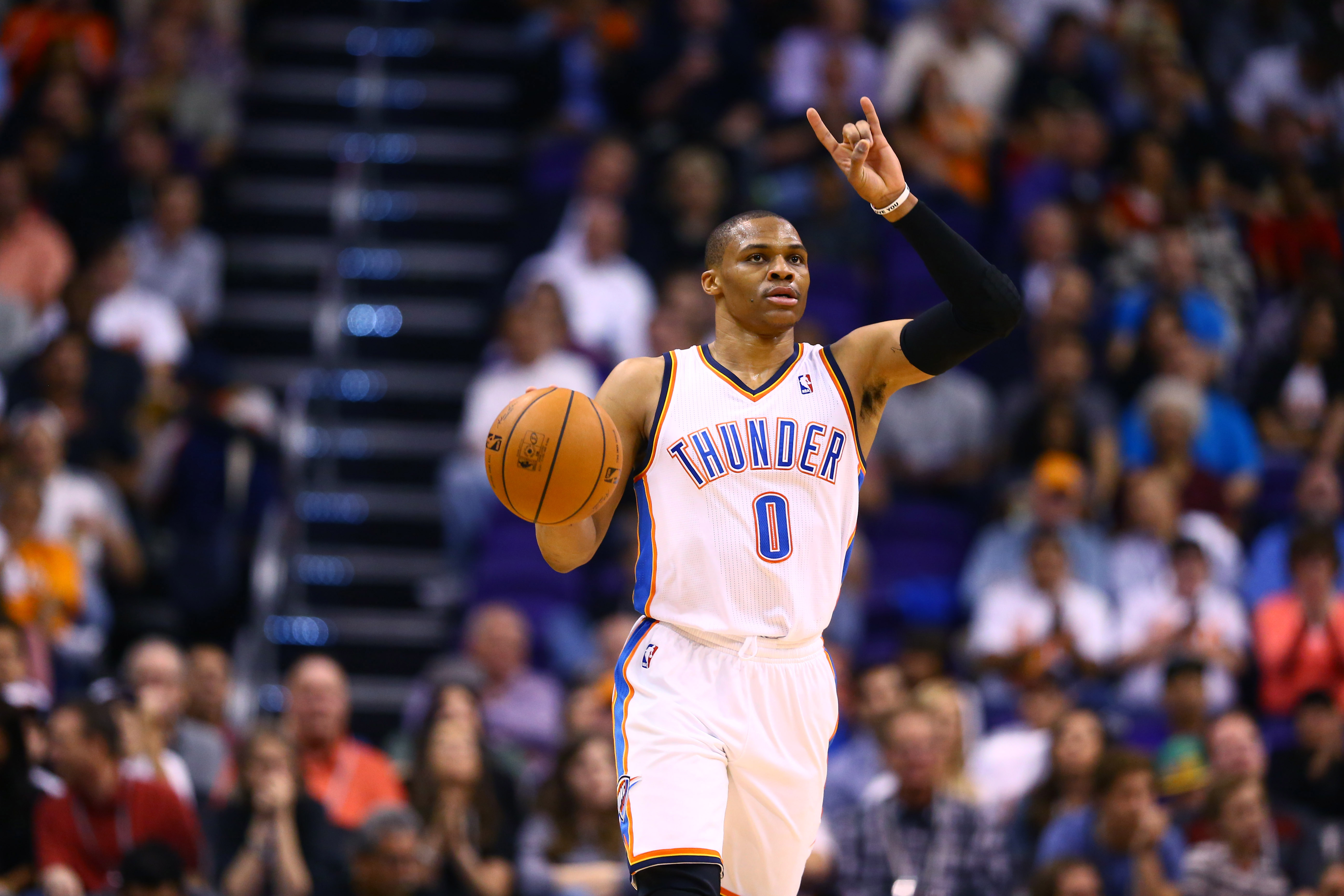 Mar 6, 2014; Phoenix, AZ, USA; Oklahoma City Thunder guard Russell Westbrook (0) against the Phoenix Suns at the US Airways Center. Mandatory Credit: Mark J. Rebilas-Imagn Images  