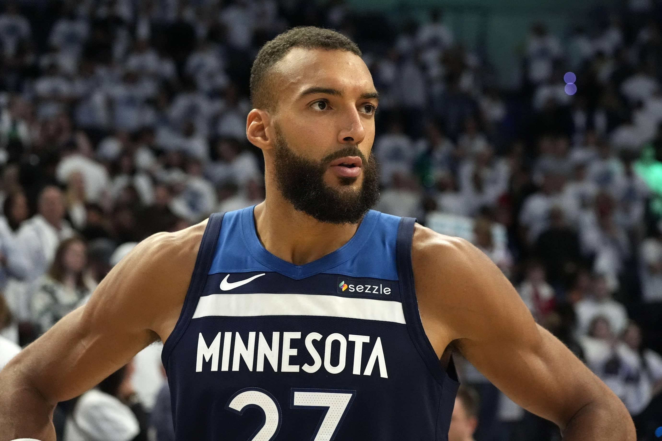 Minneapolis, Minnesota, USA; Minnesota Timberwolves center Rudy Gobert (27) reacts after the game against the Oklahoma City Thunder in game three of the western conference finals for the 2025 NBA Playoffs at Target Center. Mandatory Credit: Bruce Kluckhohn-Imagn Images