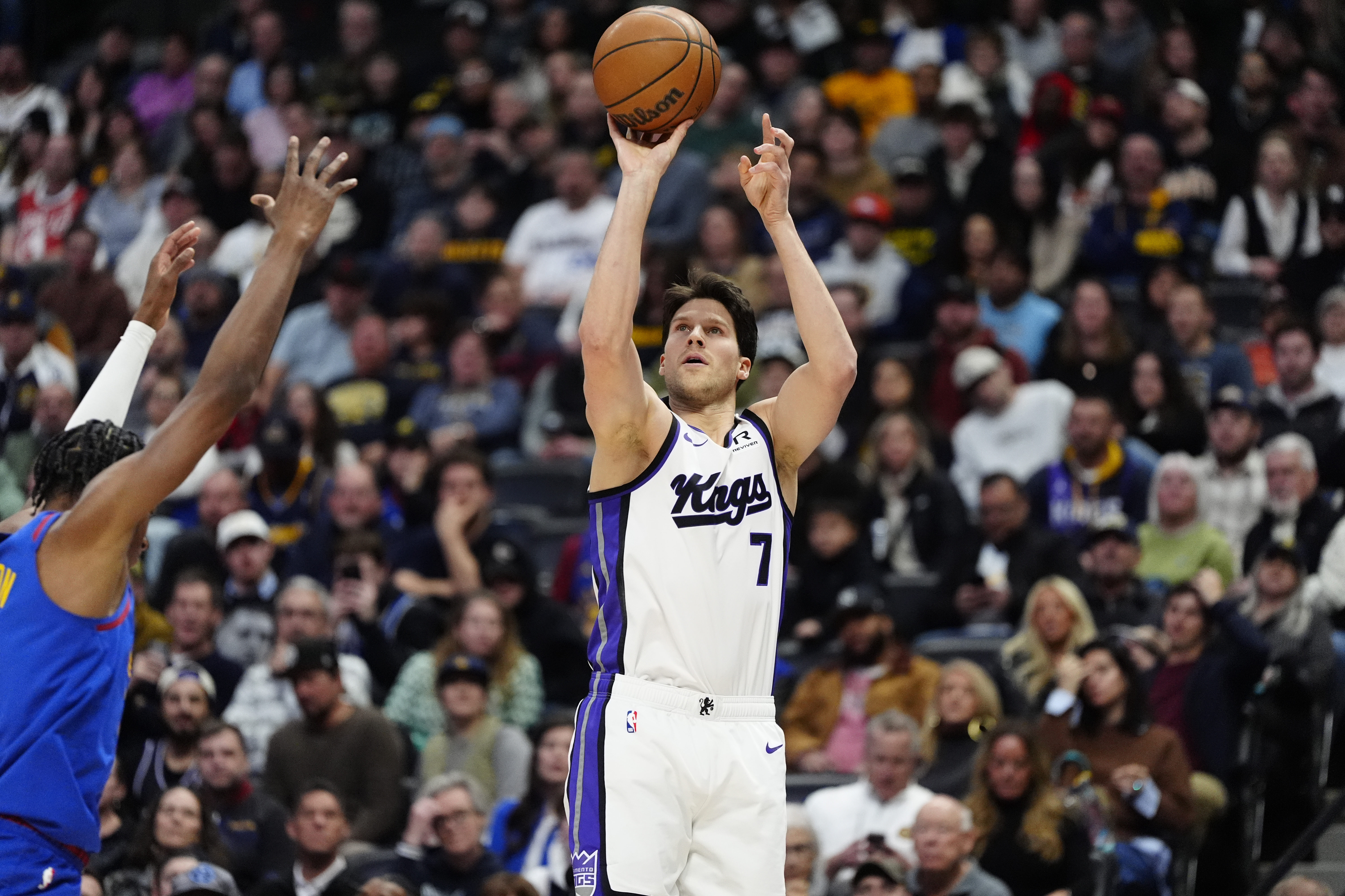 Jan 23, 2025; Denver, Colorado, USA; Sacramento Kings forward Doug McDermott (7) shoots the ball in the second half against the Denver Nuggets at Ball Arena. Mandatory Credit: Ron Chenoy-Imagn Images  