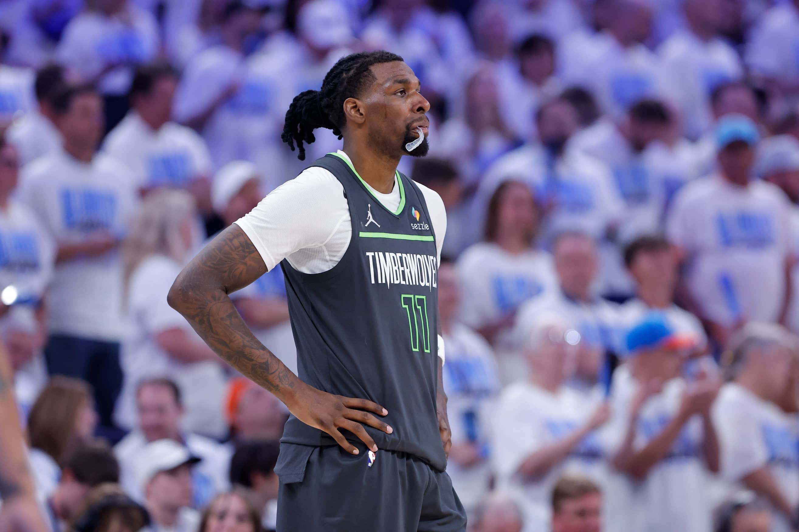 Minnesota Timberwolves center Naz Reid (11) looks down the court during a time out against the Oklahoma City Thunder in the fourth quarter during game one of the Western Conference Finals for the 2025 NBA Playoffs at Paycom Center.