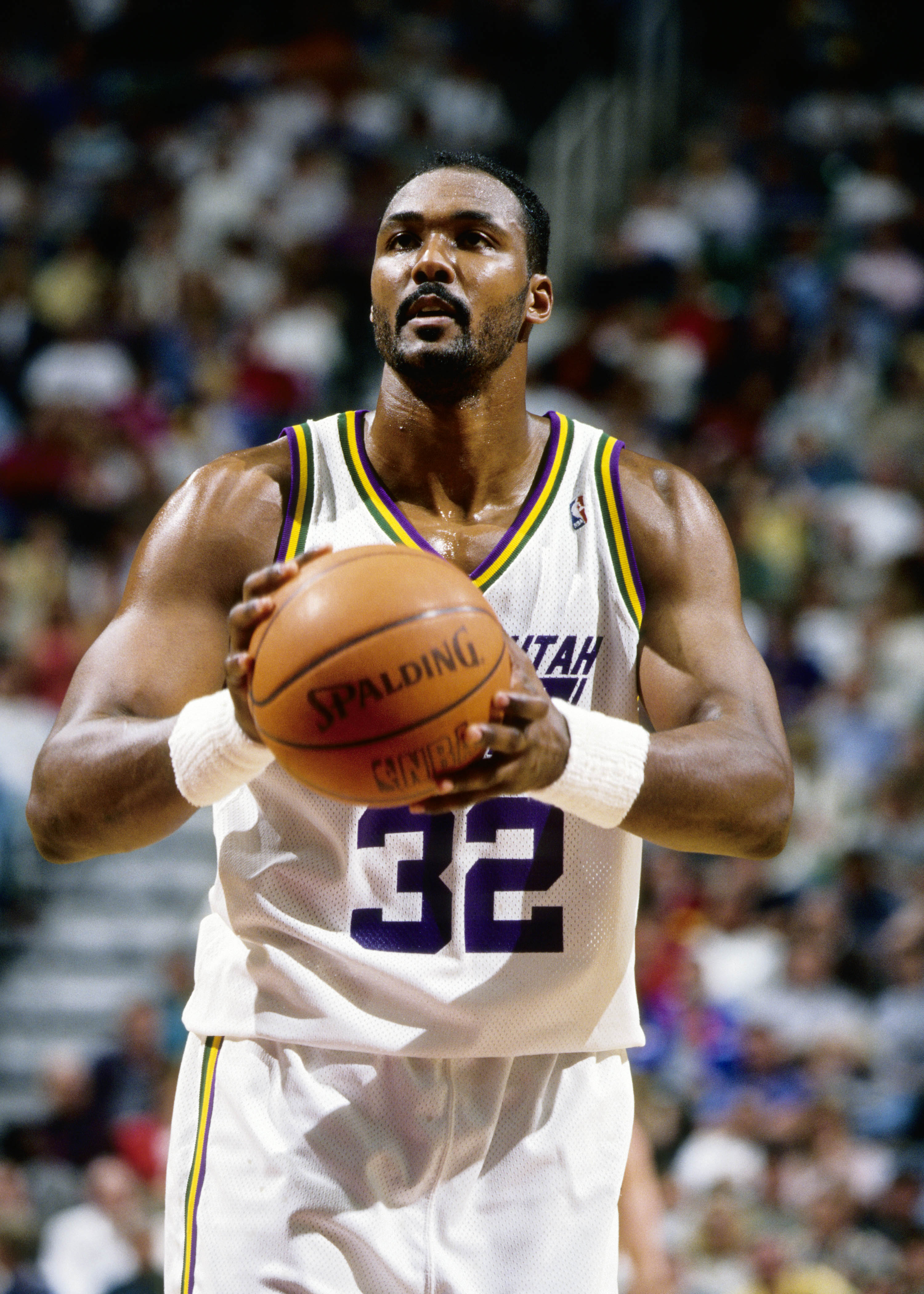 Apr 14, 1994; Salt Lake City, UT, USA; FILE PHOTO; Utah Jazz forward Karl Malone (32) shoots a free throw against the San Antonio Spurs at the Delta Center. Mandatory Credit: Imagn Images  