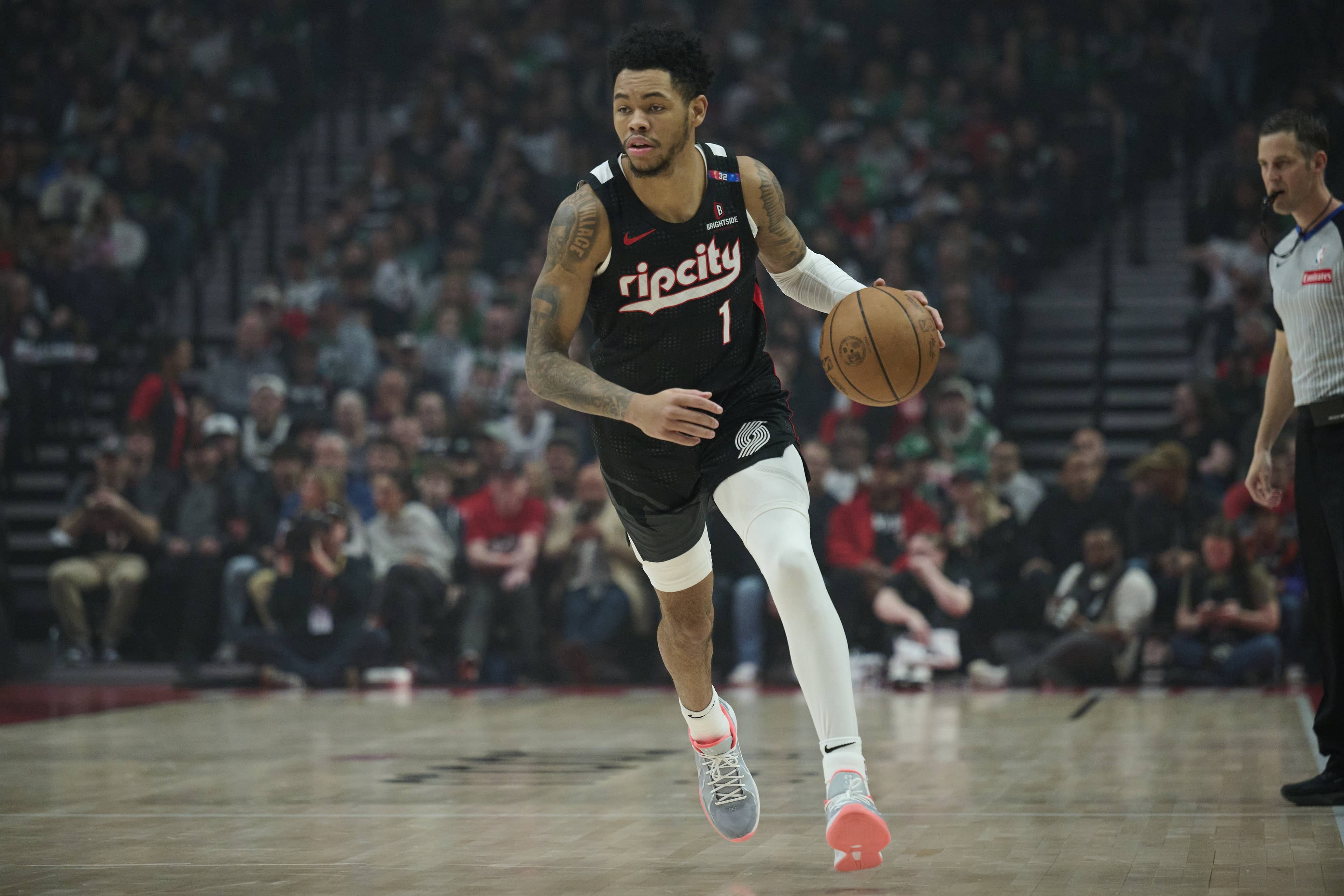 Mar 23, 2025; Portland, Oregon, USA; Portland Trail Blazers guard Anfernee Simons (1) dribbles the ball during the first half against the Boston Celtics at Moda Center. Mandatory Credit: Troy Wayrynen-Imagn Images