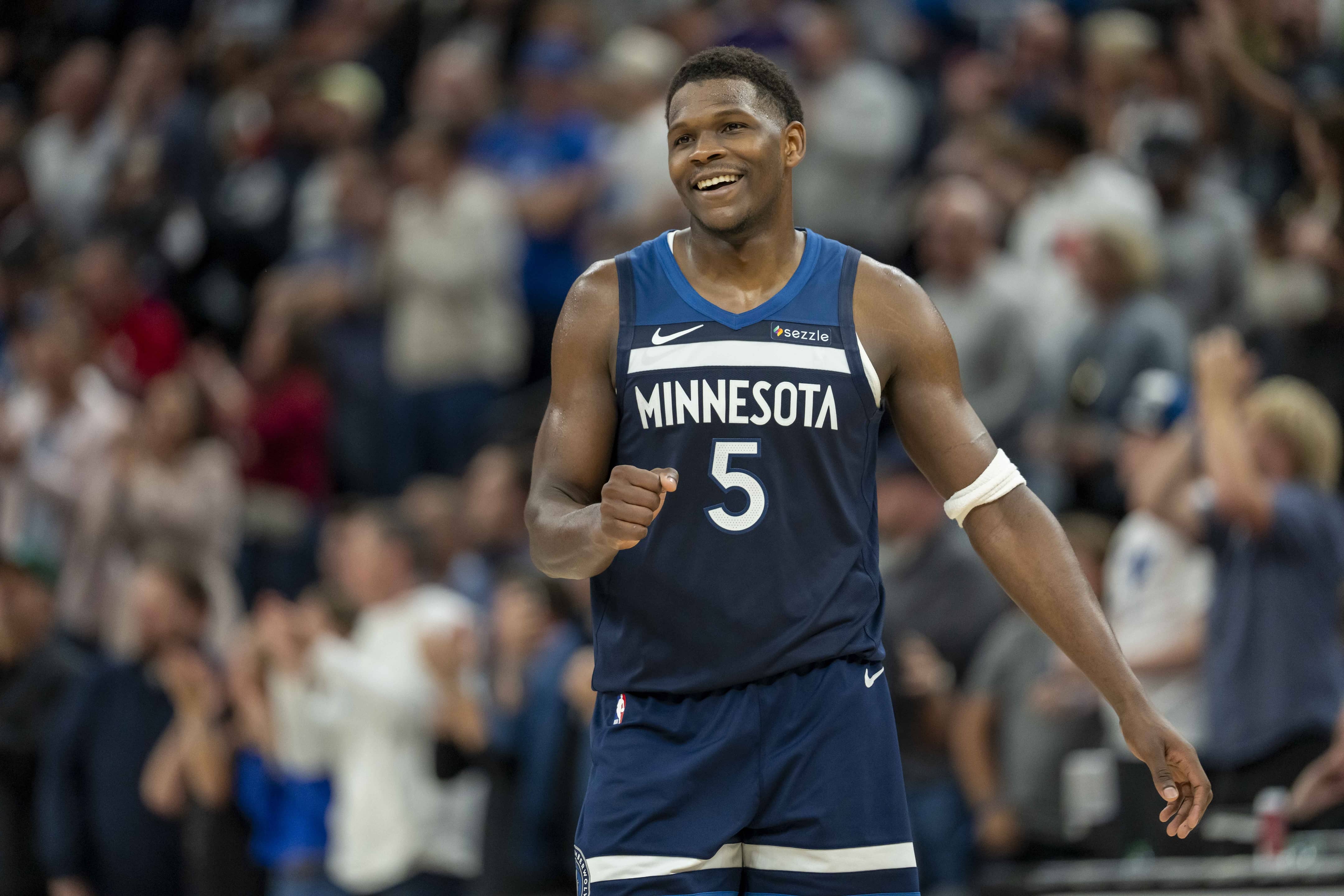 Minneapolis, Minnesota, USA; Minnesota Timberwolves guard Anthony Edwards (5) smiles after making a shot against the Miami Heat in the second half at Target Center. Mandatory Credit: Jesse Johnson-Imagn Images