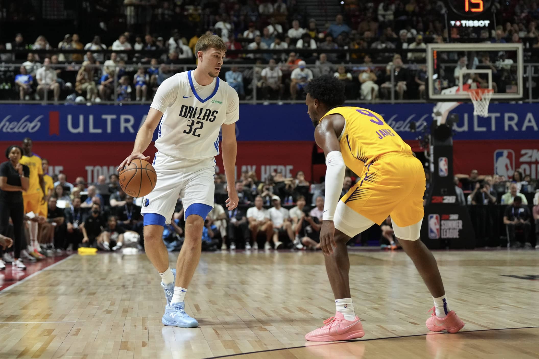 Jul 10, 2025; Las Vegas, NV, USA; Dallas Mavericks forward Cooper Flagg (32) dribbles against Los Angeles Lakers guard Bronny James (9) in the first quarter of their game at Thomas & Mack Center. Mandatory Credit: Candice Ward-Imagn Images