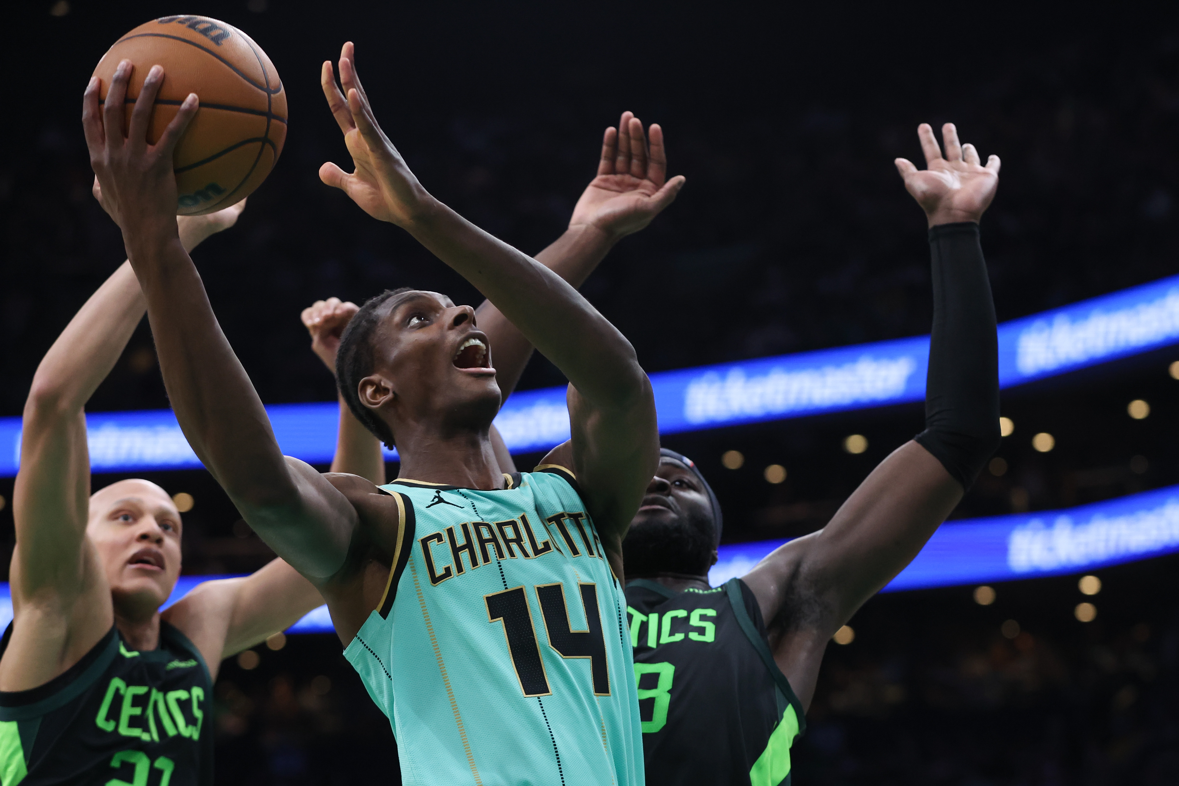 Apr 13, 2025; Boston, Massachusetts, USA; Charlotte Hornets forward Moussa Diabate (14) shoots during the second half against the Boston Celtics at TD Garden. Mandatory Credit: Paul Rutherford-Imagn Images  