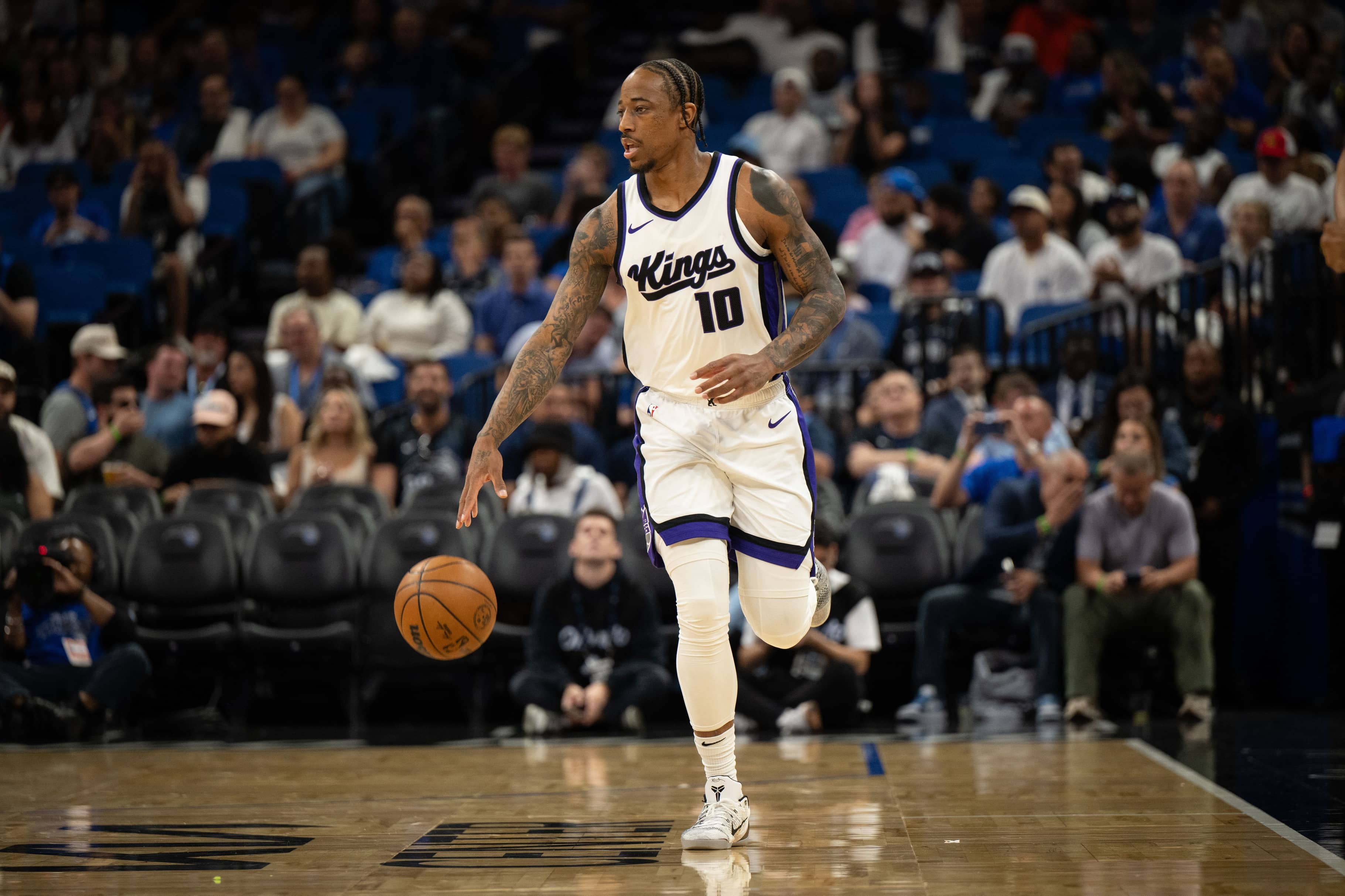 Mar 29, 2025; Orlando, Florida, USA; Sacramento Kings guard/forward DeMar DeRozan (10) dribbles the ball against the Orlando Magic in the first quarter at Kia Center. Mandatory Credit: Jeremy Reper-Imagn Images