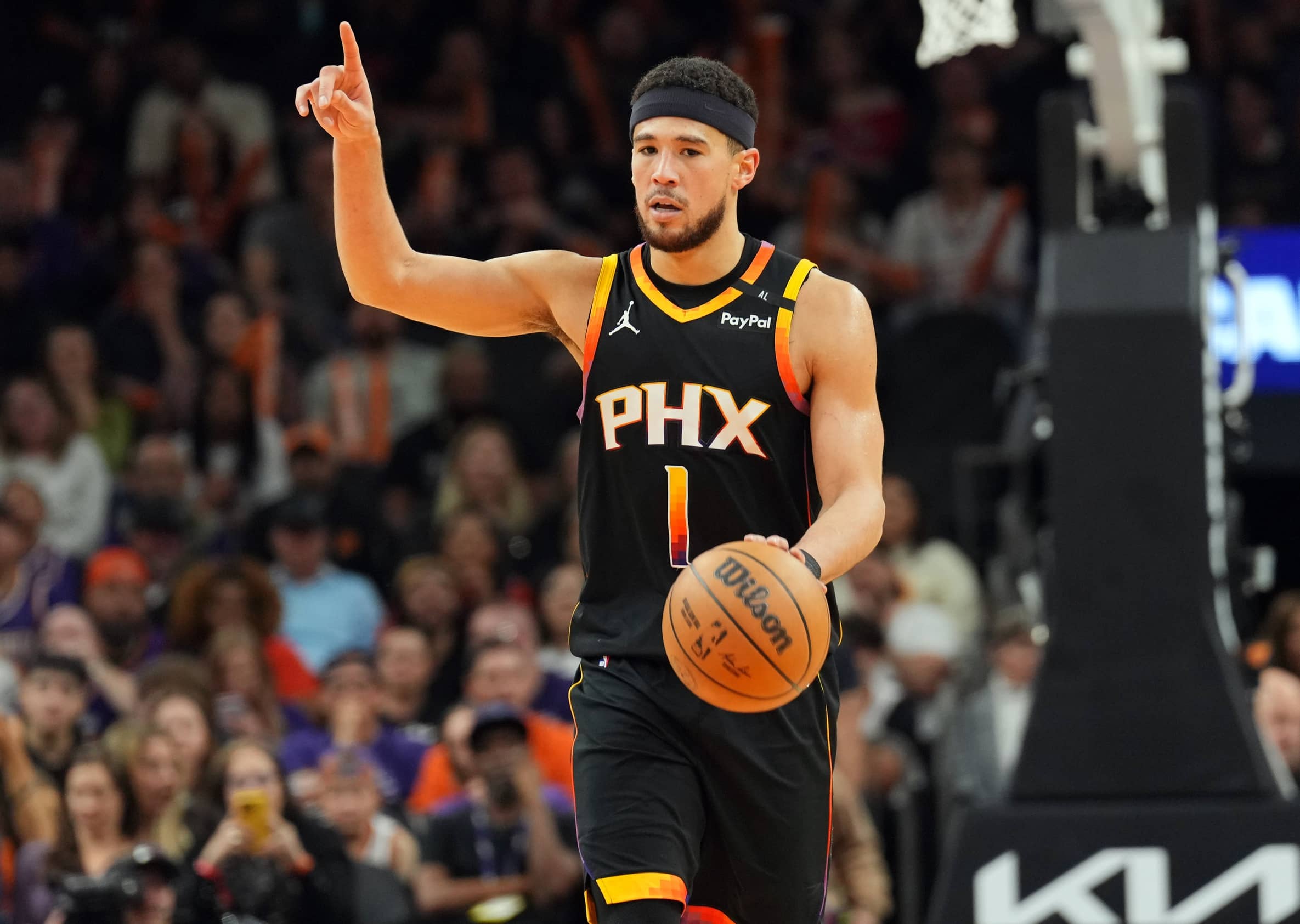 Feb 7, 2025; Phoenix, Arizona, USA; Phoenix Suns guard Devin Booker (1) dribbles against the Utah Jazz during the second half at Footprint Center. Mandatory Credit: Joe Camporeale-Imagn Images