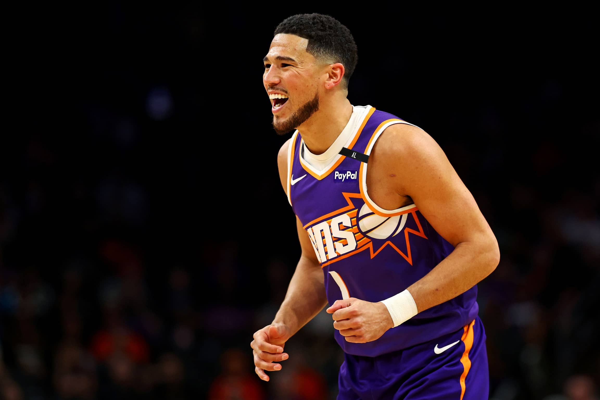 Mar 24, 2025; Phoenix, Arizona, USA; Phoenix Suns guard Devin Booker (1) reacts after a play during the first quarter against the Milwaukee Bucks at Footprint Center.