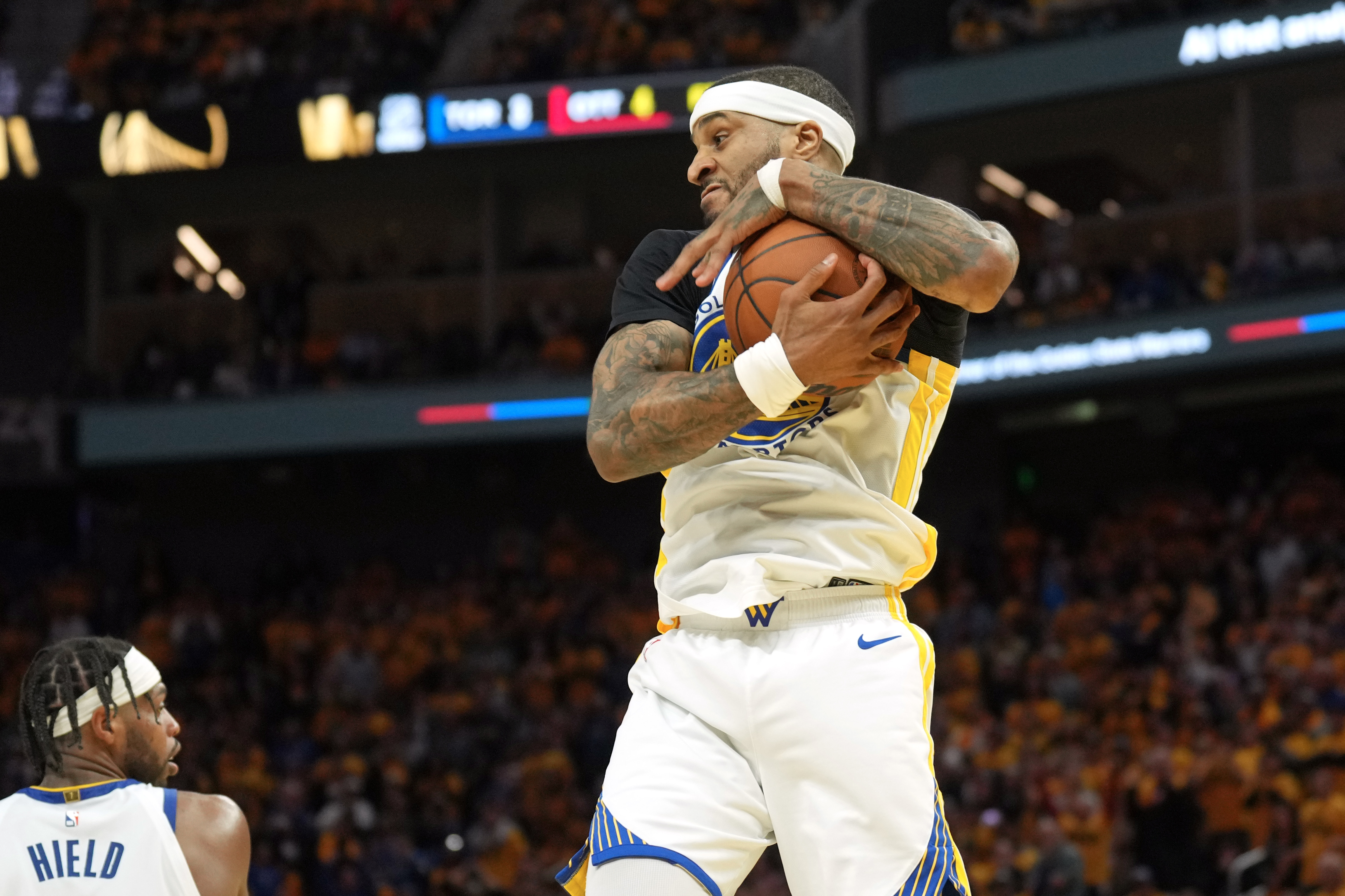 Apr 26, 2025; San Francisco, California, USA; Golden State Warriors guard Gary Payton II (0) rebounds against the Houston Rockets during the fourth quarter of game three of first round for the 2024 NBA Playoffs at Chase Center. Mandatory Credit: Darren Yamashita-Imagn Images  