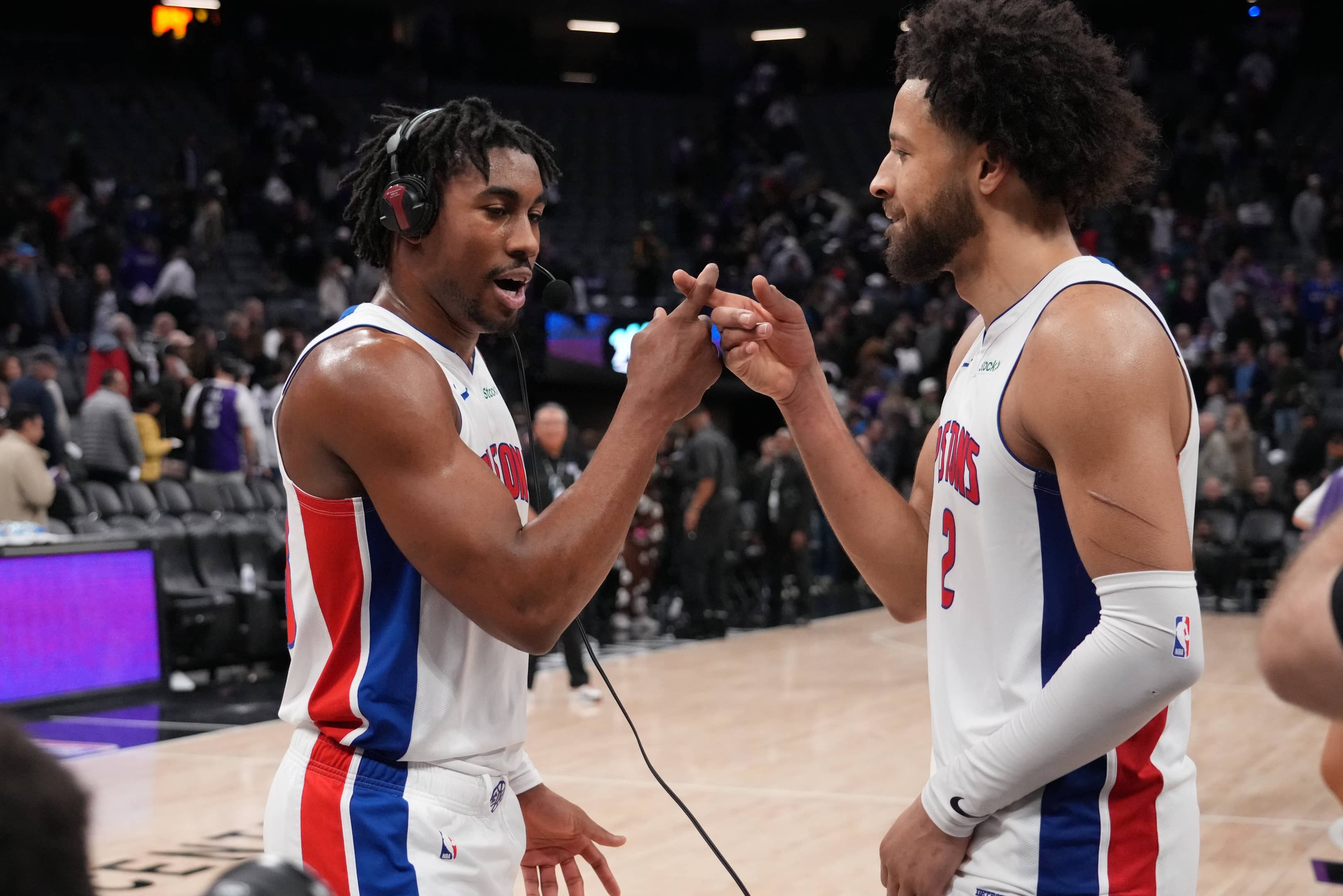 Dec 26, 2024; Sacramento, California, USA; Detroit Pistons guard Jaden Ivey (23) and guard Cade Cunningham (2) celebrate after the win against the Sacramento Kings at Golden 1 Center. Mandatory Credit: Kelley L Cox-Imagn Images