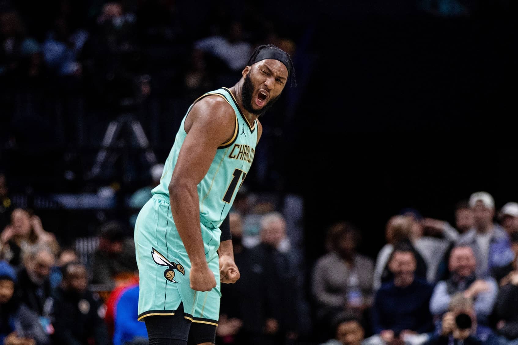 Jan 24, 2025; Charlotte, North Carolina, USA; Charlotte Hornets forward Josh Okogie (12) celebrates during the second quarter against the Portland Trail Blazers at Spectrum Center. Mandatory Credit: Scott Kinser-Imagn Images