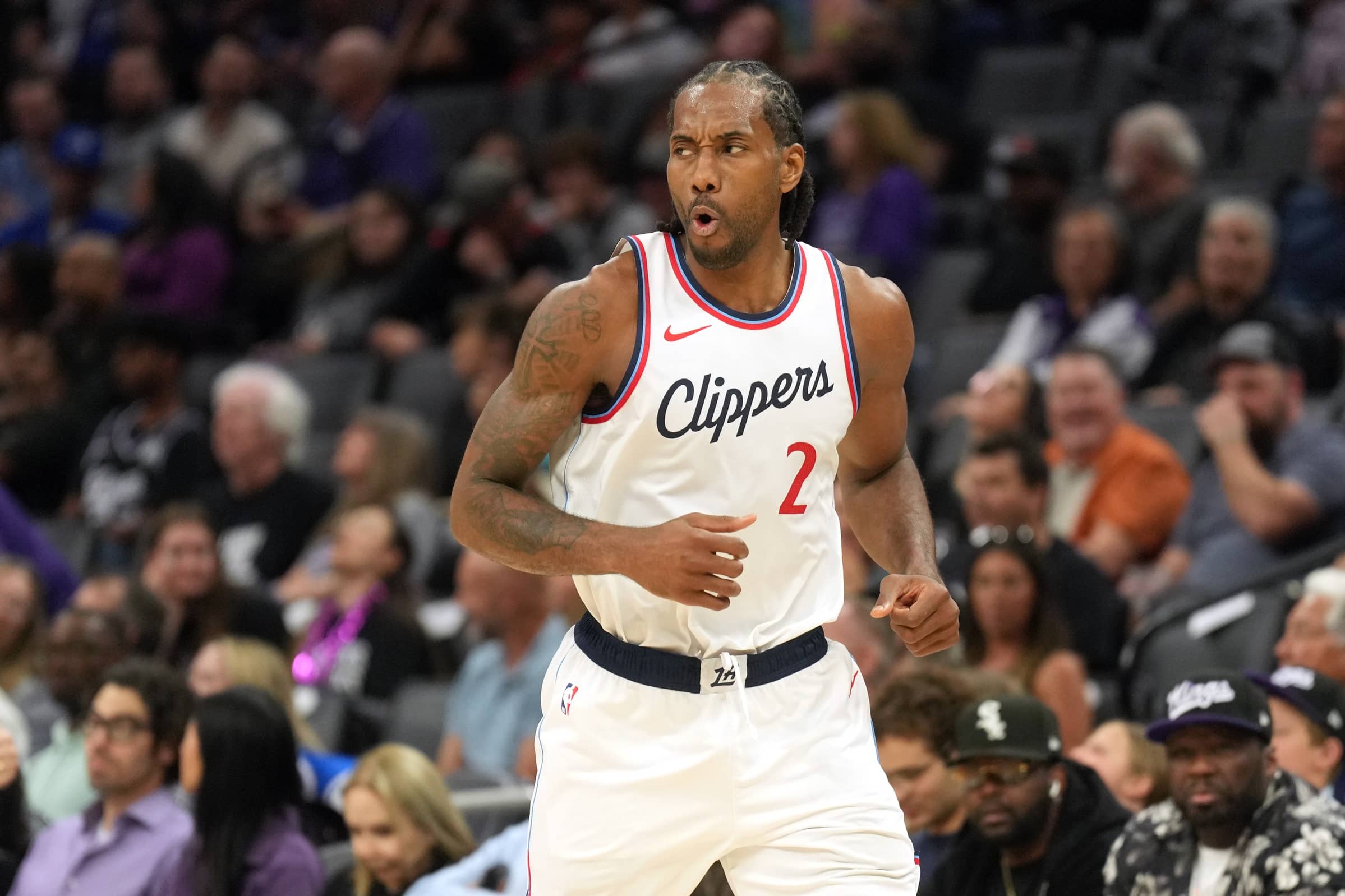 Apr 11, 2025; Sacramento, California, USA; Los Angeles Clippers forward Kawhi Leonard (2) reacts after making a three point basket against the Sacramento Kings during the second quarter at Golden 1 Center. Mandatory Credit: Darren Yamashita-Imagn Images