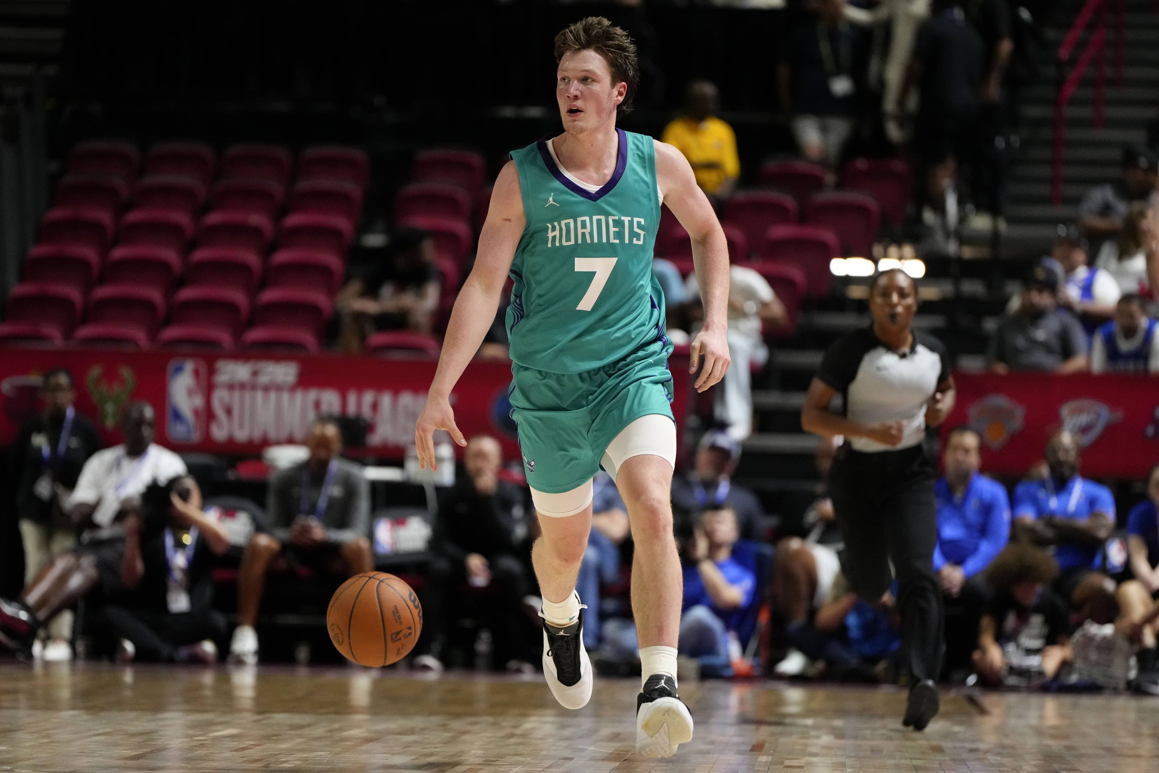Jul 14, 2025; Las Vegas, NV, USA; Charlotte Hornets guard Kon Knueppel (7) dribbles the ball against the Dallas Mavericks during the second half of a NBA basketball game at the Thomas & Mack Center. Mandatory Credit: Lucas Peltier-Imagn Images